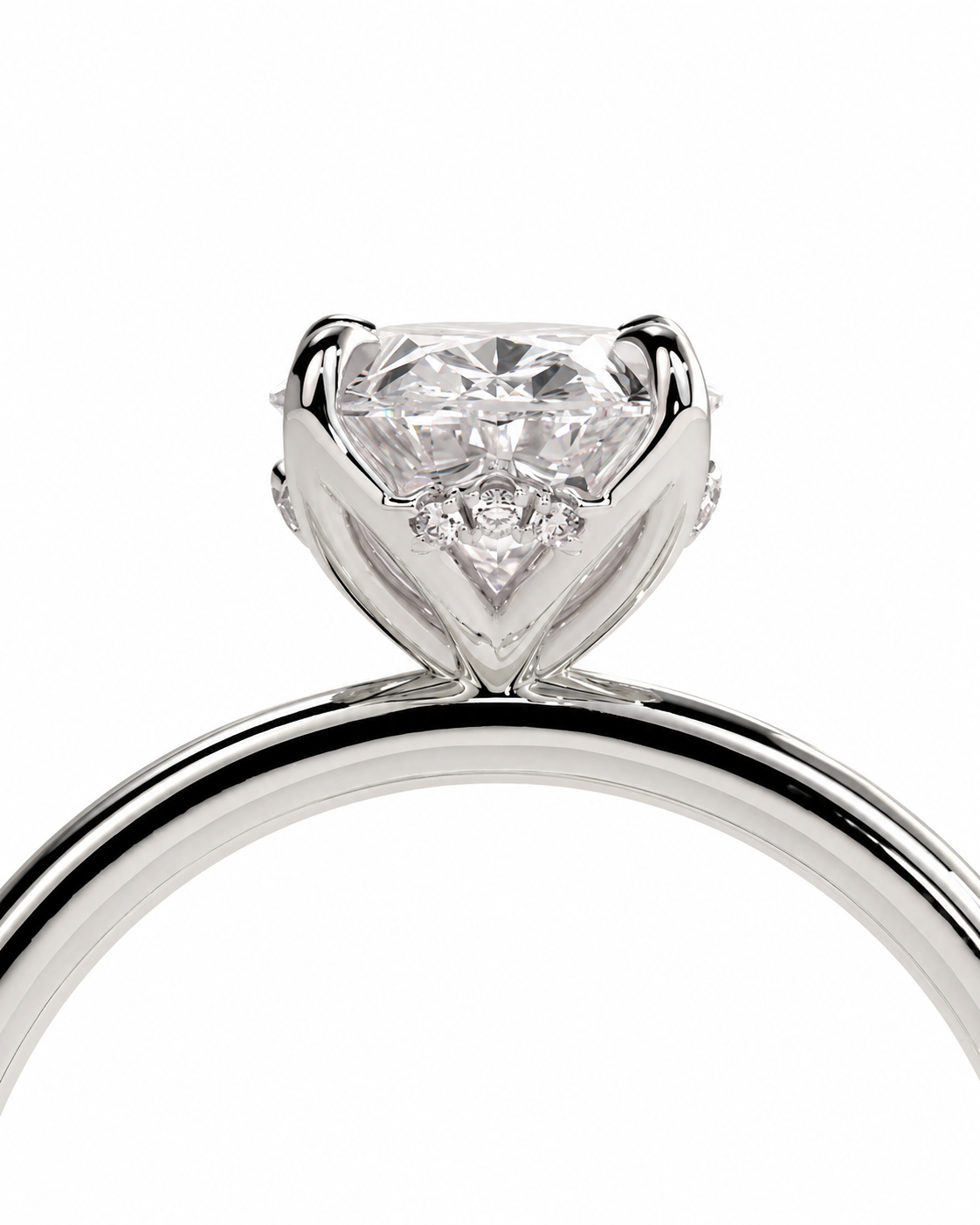 color_925_SIL,color_935_ARG,color_10K_WG, color_14K_WG &&A close-up studio shot of a silver-toned diamond ring with a heart-shaped clear gemstone in a prong setting, shown against a plain white background.