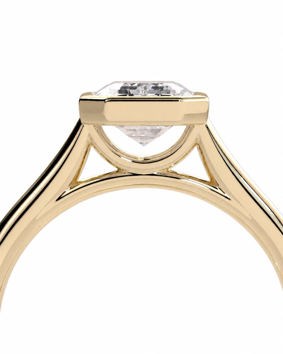 color_10K_YG, color_14K_YG &&Close-up of a yellow gold solitaire engagement ring with a clear round-cut diamond in a bezel setting, shown on a plain white background.