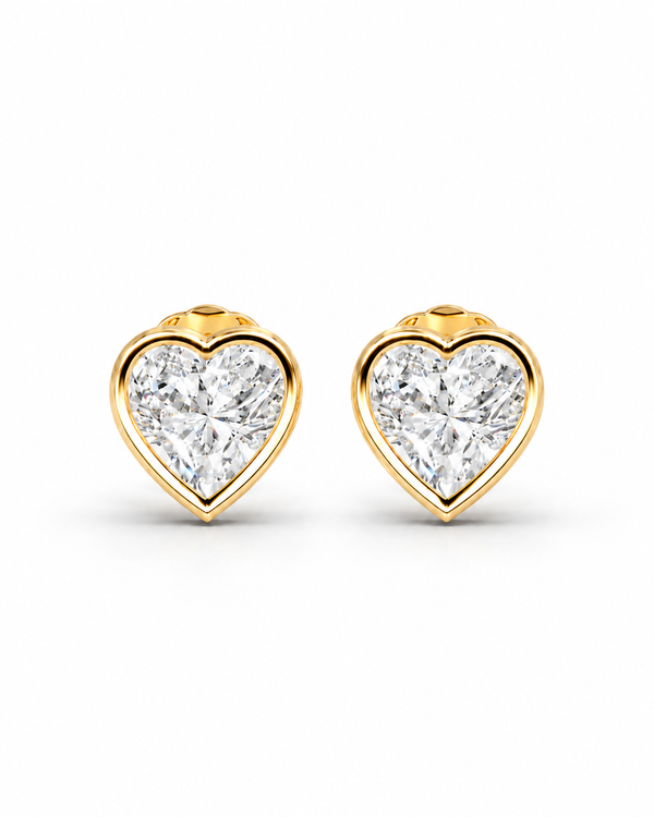 color_10K_YG, color_14K_YG &&A pair of heart-shaped stud earrings featuring brilliant-cut clear gemstones in a polished yellow gold bezel setting, presented on a clean white background.