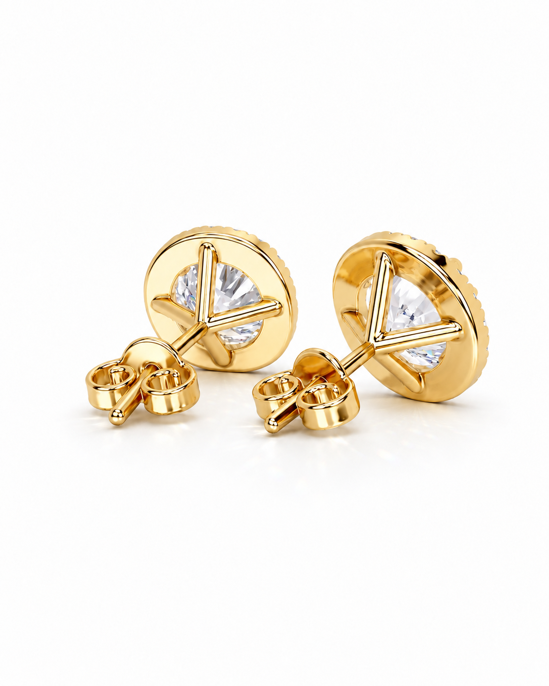color_10K_YG, color_14K_YG &&A pair of gold stud earrings with a triangular prong setting and a clear round-cut gemstone, shown from the back on a clean white background.