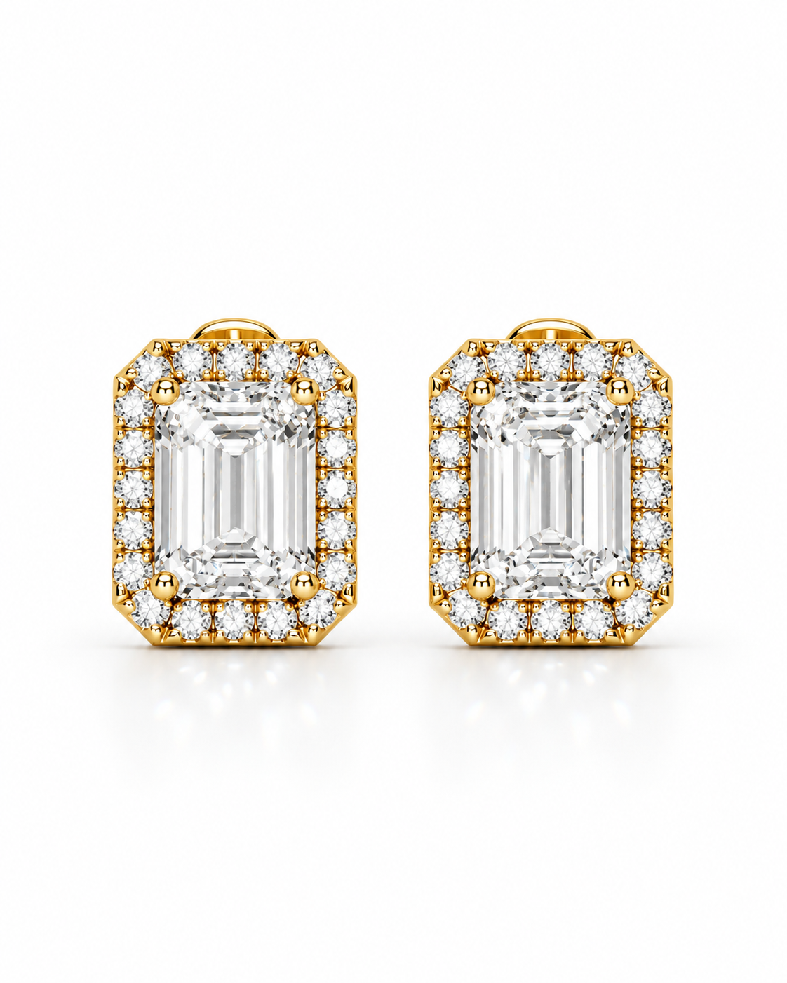 color_10K_YG, color_14K_YG &&A pair of yellow gold stud earrings featuring large emerald-cut clear gemstones surrounded by smaller halo stones, set against a clean white background.