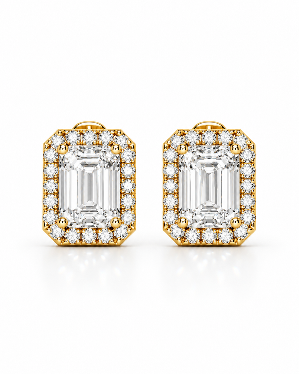 color_10K_YG, color_14K_YG &&A pair of yellow gold stud earrings featuring large emerald-cut clear gemstones surrounded by smaller halo stones, set against a clean white background.