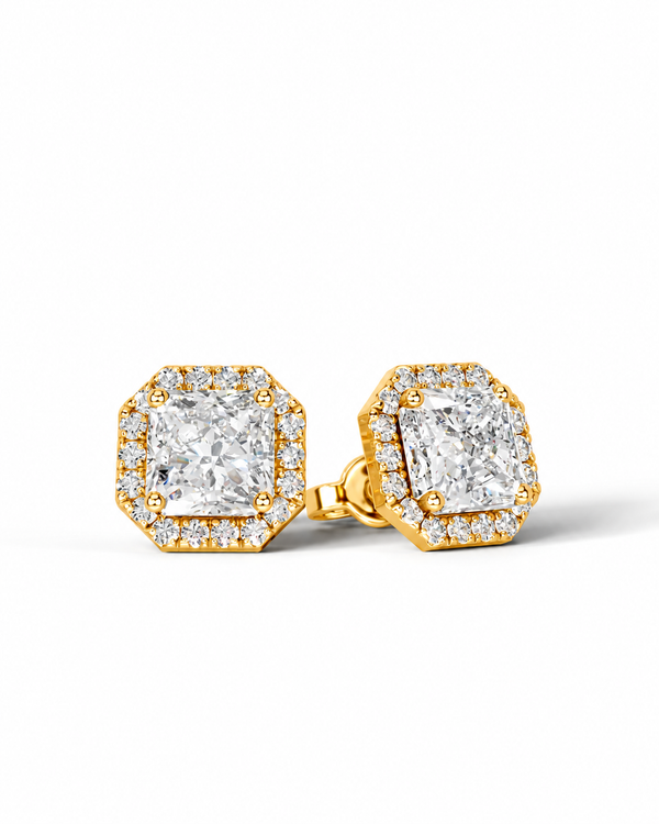 color_10K_YG, color_14K_YG &&A pair of gold-toned hexagonal stud earrings featuring large round-cut center stones surrounded by smaller halo stones, shown on a clean white background.