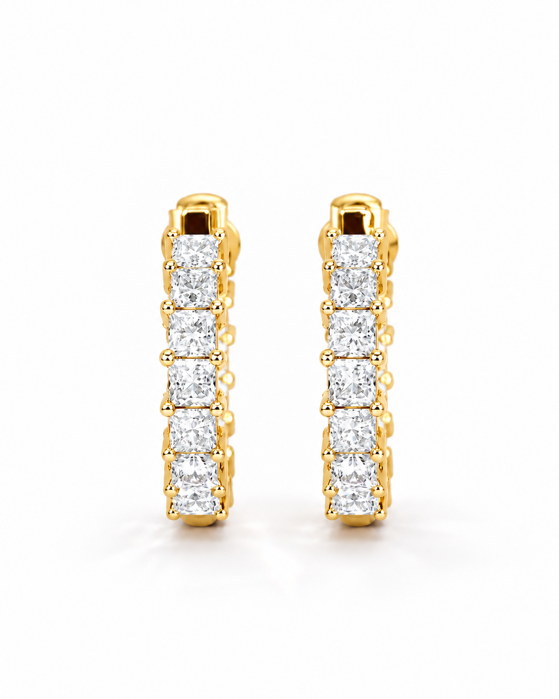 color_10K_YG, color_14K_YG &&A pair of gold huggie hoop earrings set with a row of princess-cut diamonds, shown against a clean white background.