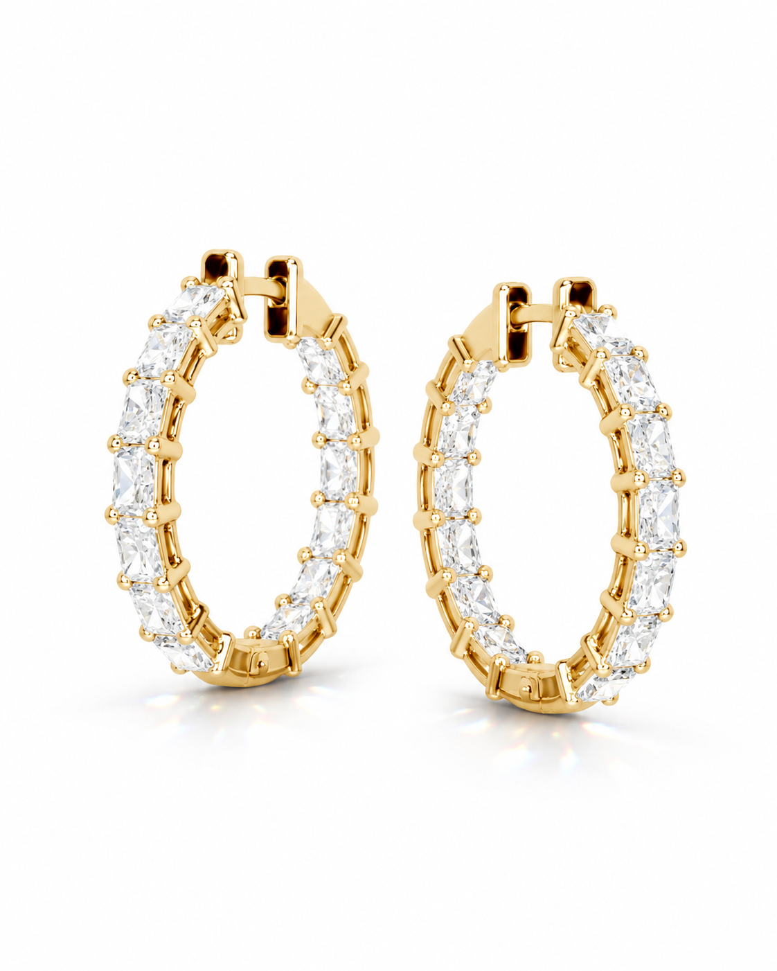 color_10K_YG, color_14K_YG &&A pair of gold hoop earrings set with clear marquise-cut gemstones, shown on a clean white background.