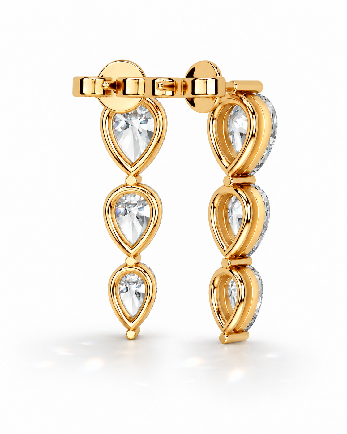color_10K_YG, color_14K_YG &&A pair of gold drop earrings featuring three pear-cut clear gemstones in each earring, accented with small clear stones along the sides, set against a clean white background.