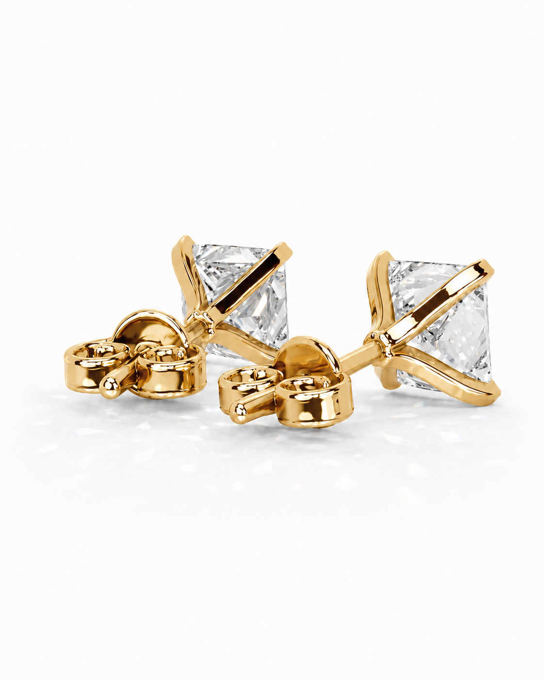 color_10K_YG, color_14K_YG &&A pair of gold stud earrings with square clear gemstones, shown from both front and side angles on a clean white background.
