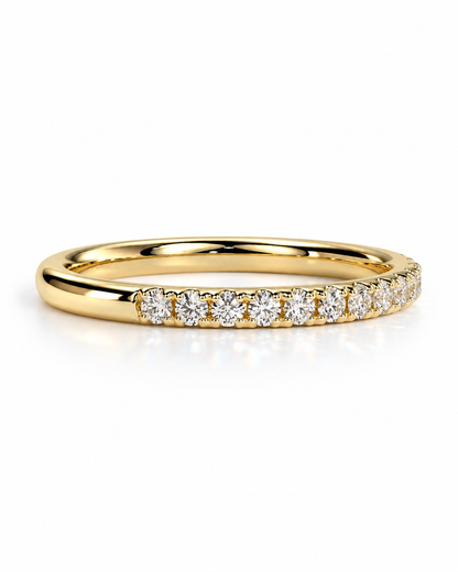 color_10K_YG, color_14K_YG &&A 
A yellow gold eternity ring featuring a row of round-cut clear gemstones set in a prong setting, shown on a clean white background with a soft reflection.