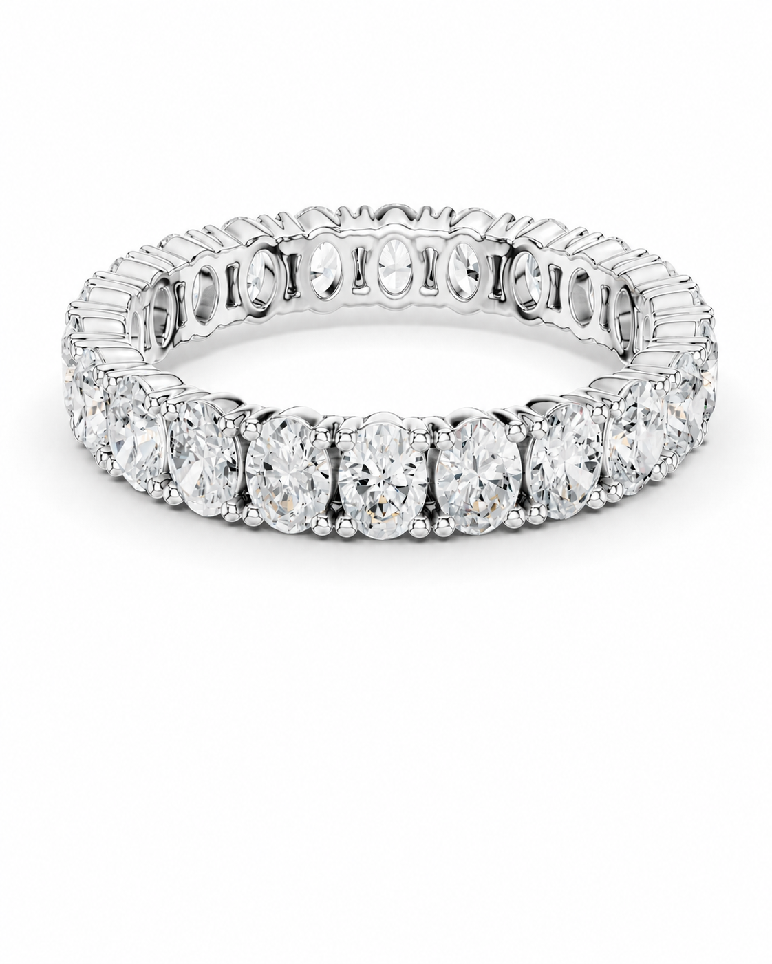 color_925_SIL,color_935_ARG,color_10K_WG, color_14K_WG &&A silver-toned eternity ring featuring a continuous row of oval-cut and baguette-cut clear gemstones, shown on a plain white background.