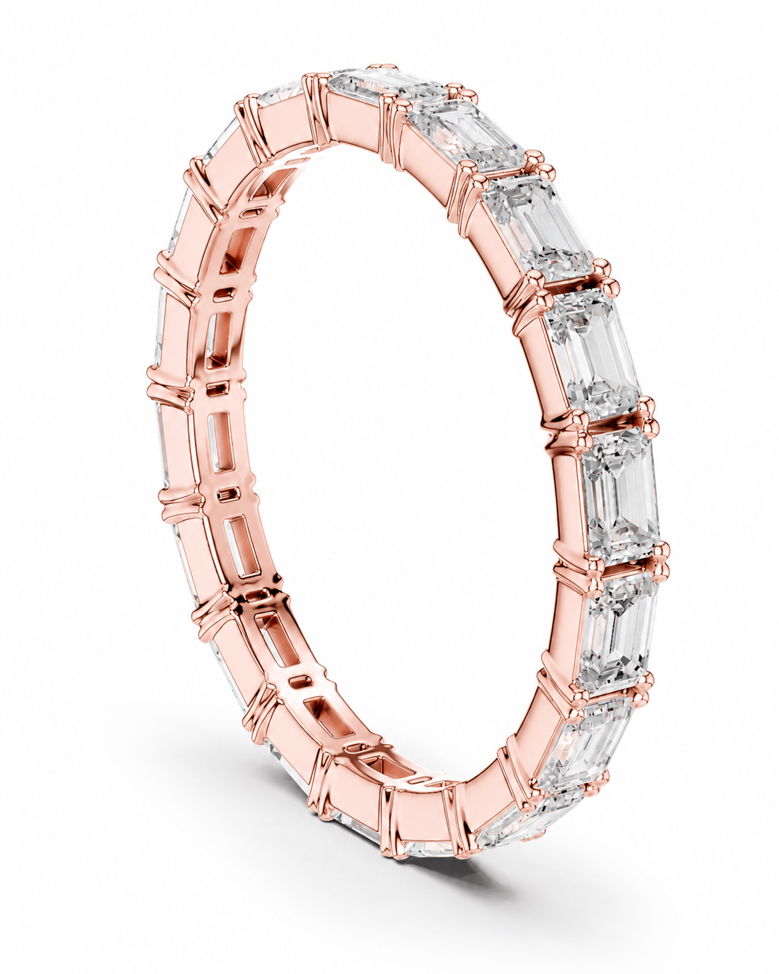color_10K_RG, color_14K_RG &&A rose gold eternity ring featuring a continuous row of baguette-cut clear gemstones, shown on a clean white background.