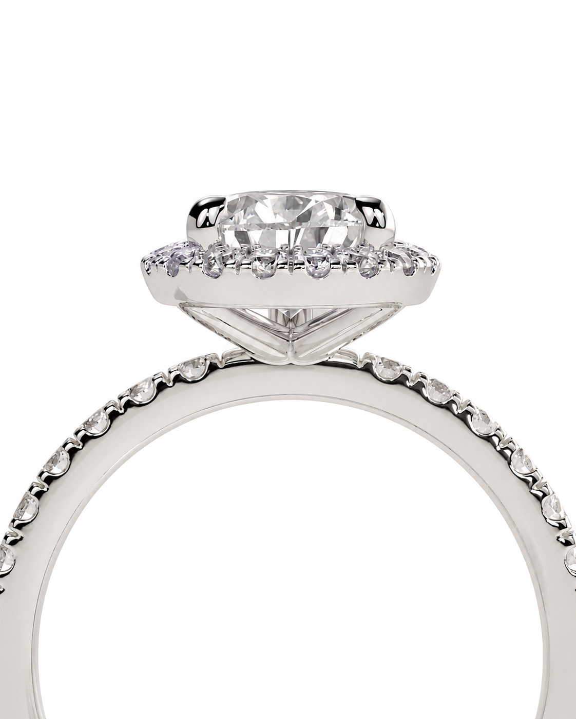 color_925_SIL,color_935_ARG,color_10K_WG, color_14K_WG &&A close-up studio shot of a silver-toned diamond ring featuring a large round-cut center stone surrounded by a halo of small diamonds, with a pavé-set band.
