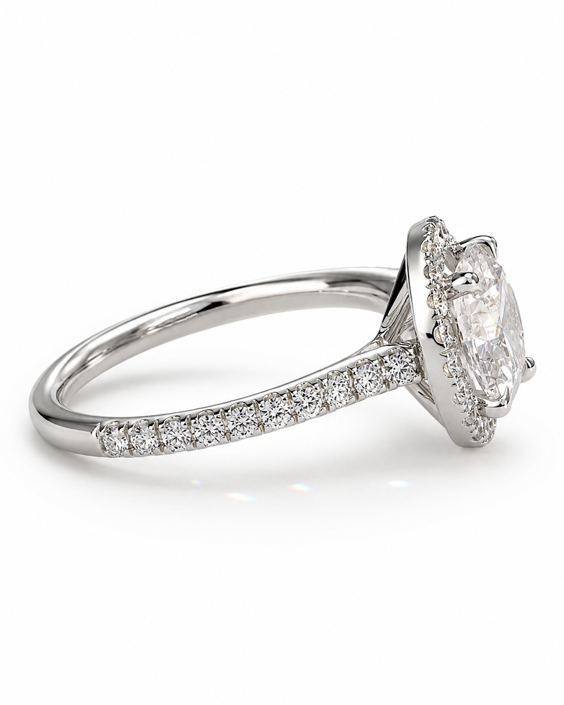 color_925_SIL,color_935_ARG,color_10K_WG, color_14K_WG &&A silver-toned diamond engagement ring featuring a round brilliant-cut center stone in a halo setting, with a pavé band, shown on a clean white background.