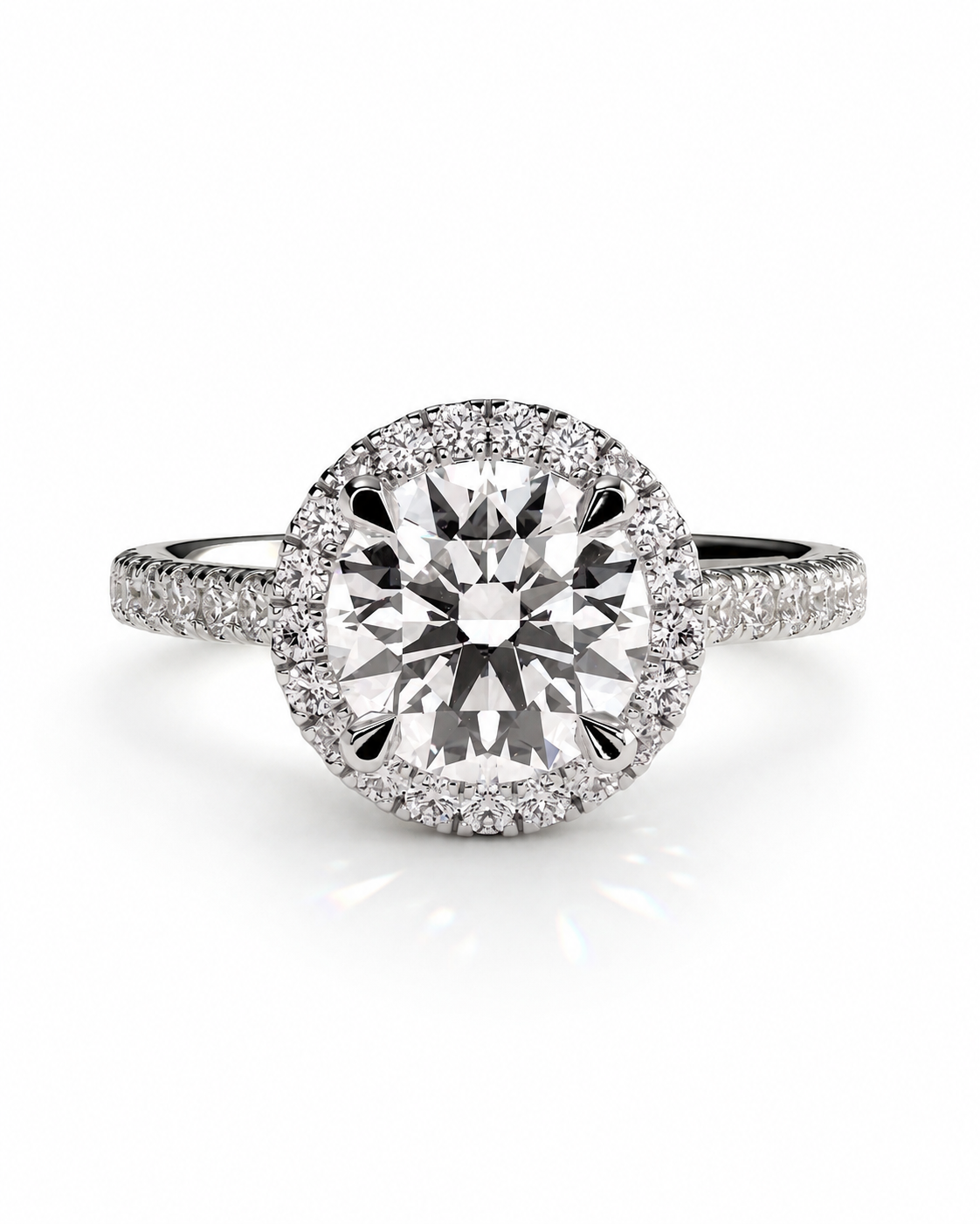 color_925_SIL,color_935_ARG,color_10K_WG, color_14K_WG &&A round halo engagement ring featuring a large center diamond surrounded by a halo of smaller diamonds, set on a pavé band, shown on a white background.