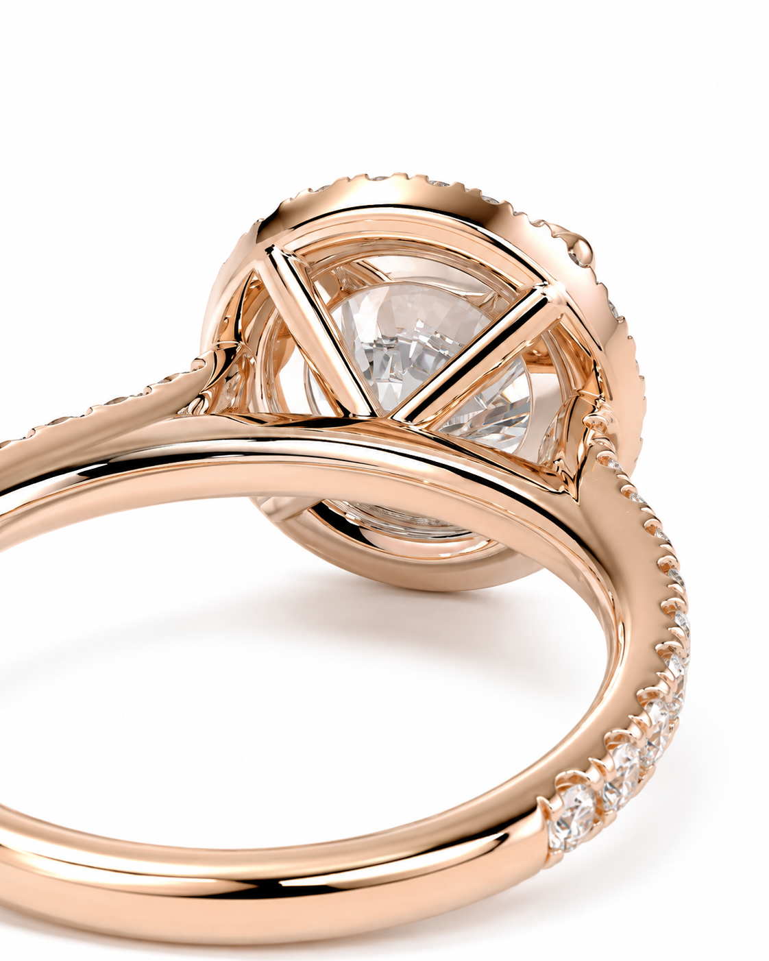 color_10K_RG, color_14K_RG &&Close-up of a rose gold ring with a round clear gemstone in a geometric setting, showing the polished band and small pavé accents on a white background.