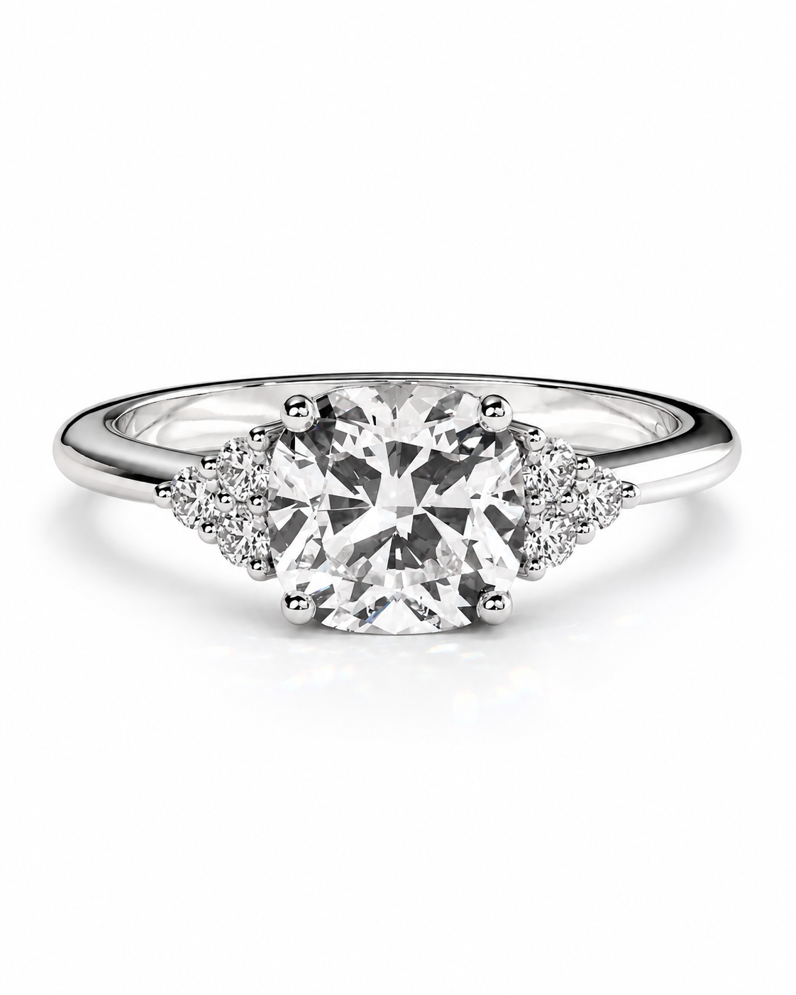 color_925_SIL,color_935_ARG,color_10K_WG, color_14K_WG &&A radiant cut diamond engagement ring in a polished silver-colored metal band, featuring small accent diamonds on either side of the center stone, set against a clean white background.