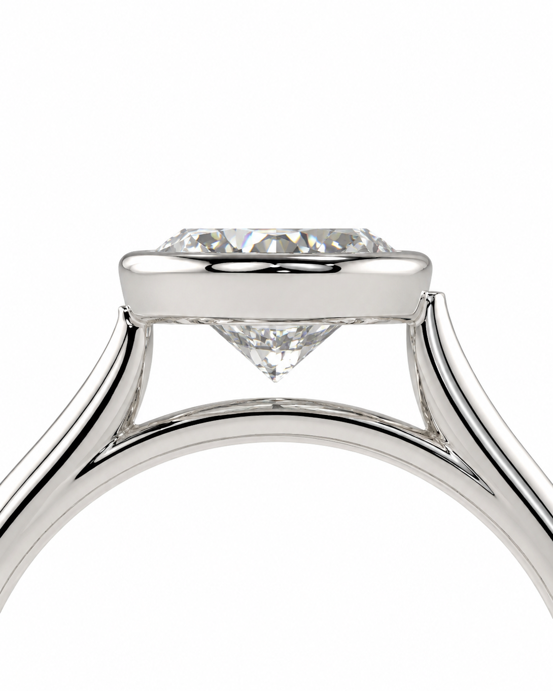 color_925_SIL,color_935_ARG,color_10K_WG, color_14K_WG &&Close-up of a diamond ring setting with a round brilliant-cut diamond held in a polished silver-colored metal band, shown against a solid white background.