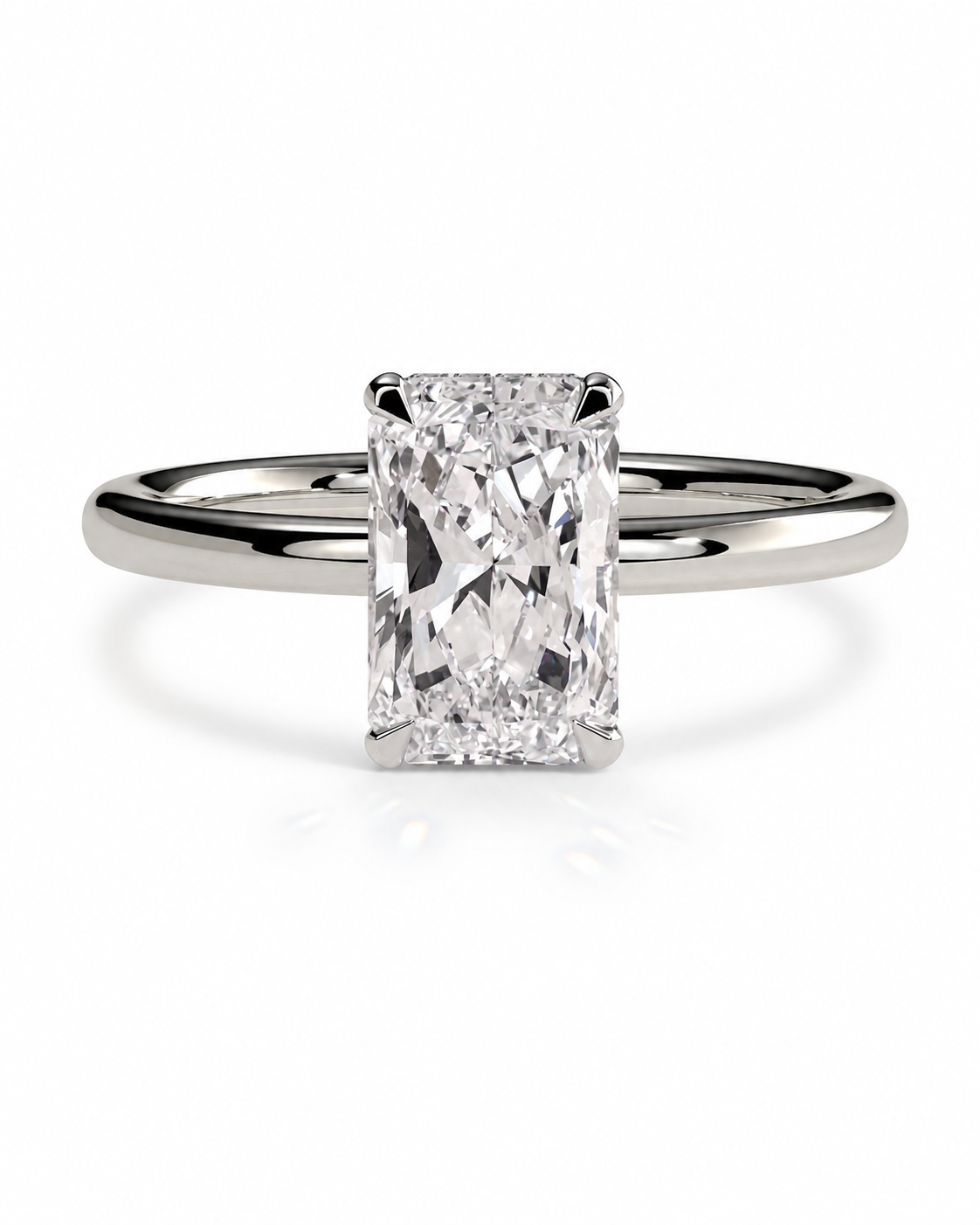 color_925_SIL,color_935_ARG,color_10K_WG, color_14K_WG &&A radiant cut diamond engagement ring with a polished silver-colored band, centered on a clean white background.