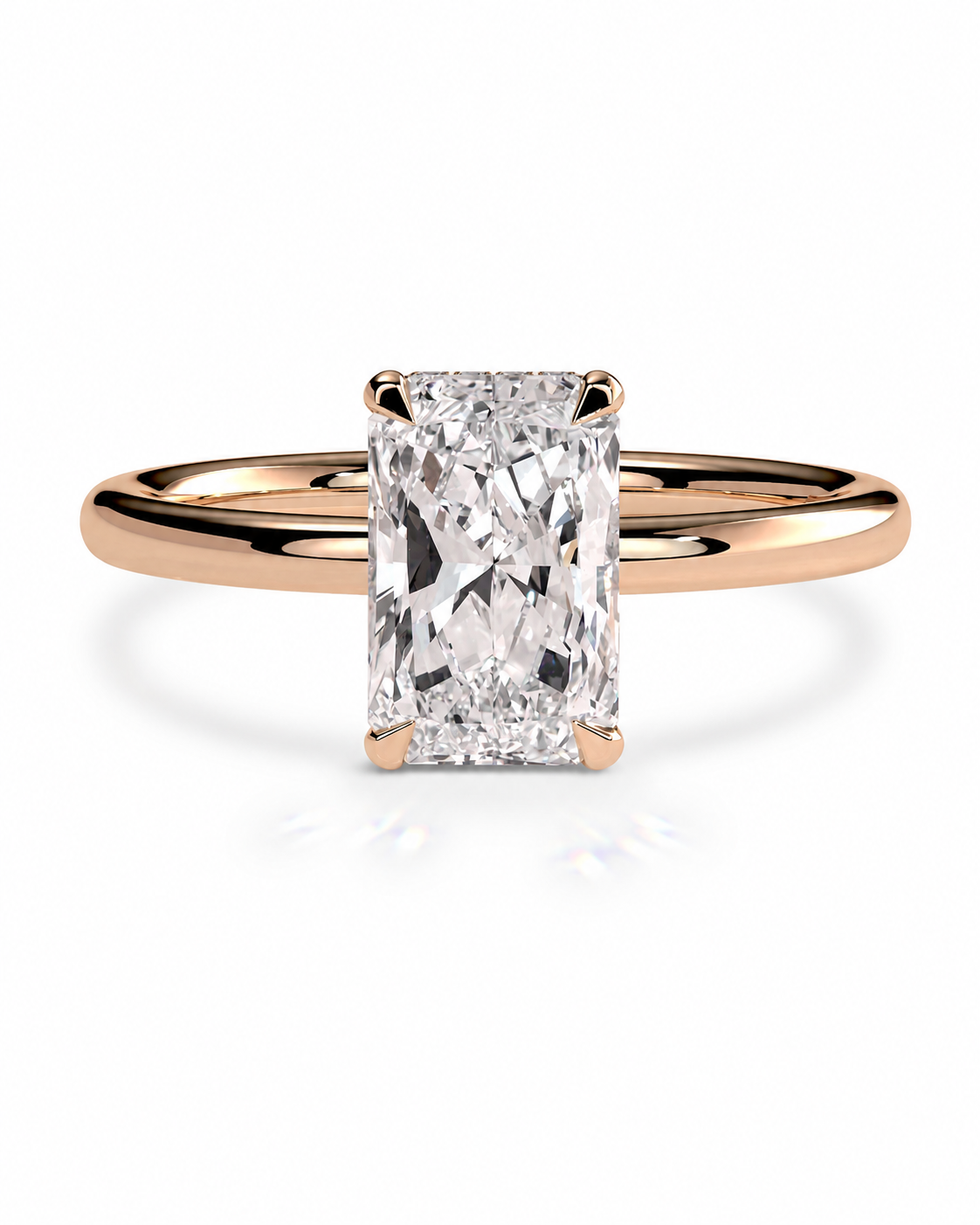 color_10K_RG, color_14K_RG &&A radiant cut diamond engagement ring with a rose gold band, shown on a clean white background with a soft reflection.