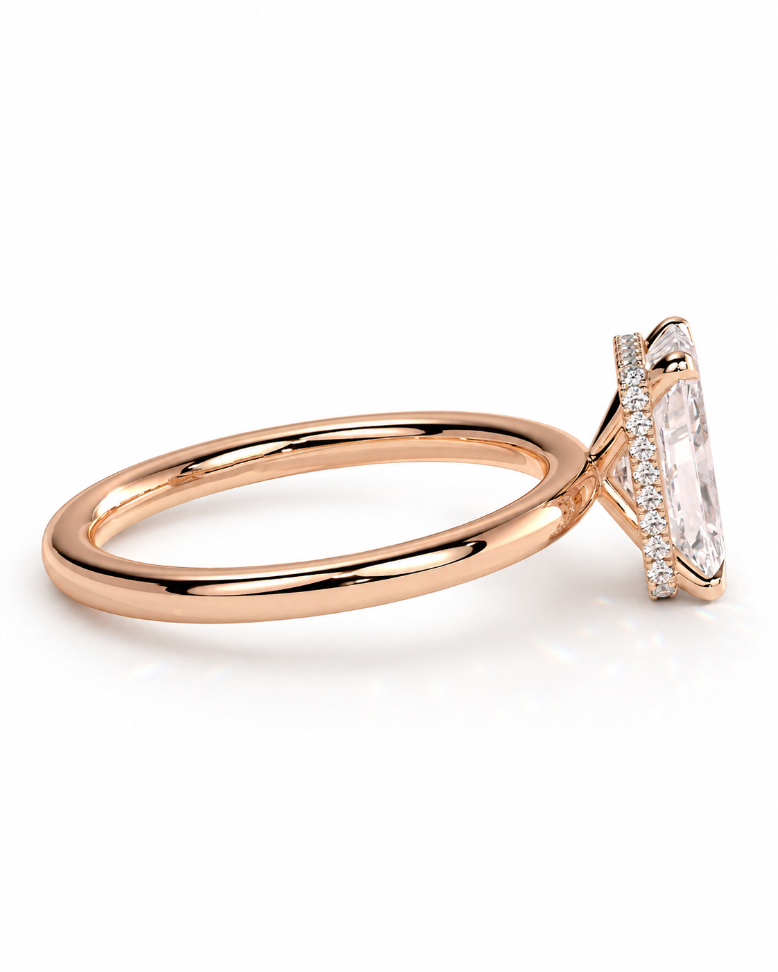 color_10K_RG, color_14K_RG &&Rose gold ring with a marquise-cut clear gemstone and pavé accents, shown in a side profile on a white background.