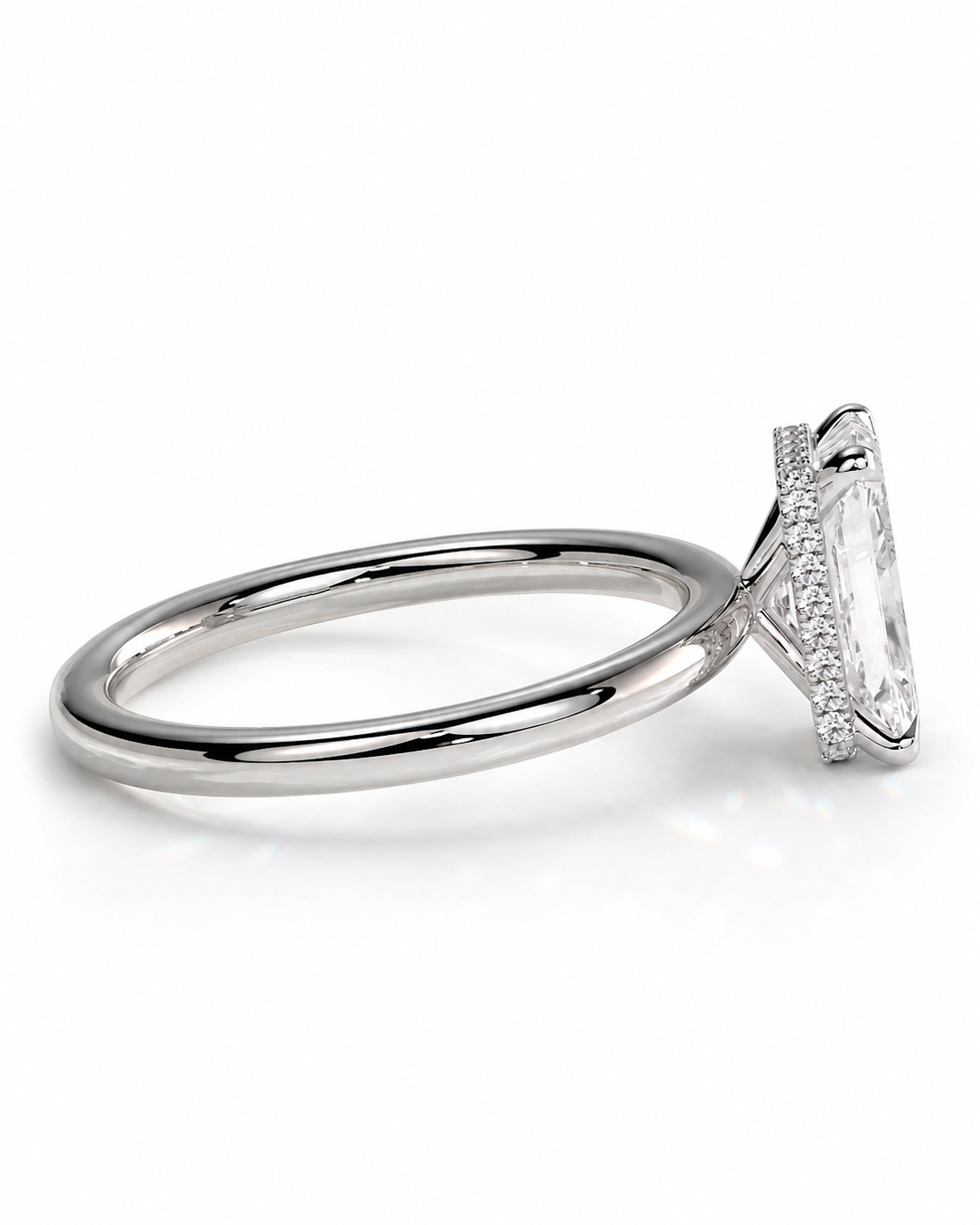 color_925_SIL,color_935_ARG,color_10K_WG, color_14K_WG &&A silver-toned solitaire engagement ring featuring a marquise-cut clear center stone in a halo setting with a polished band, shown on a clean white background.