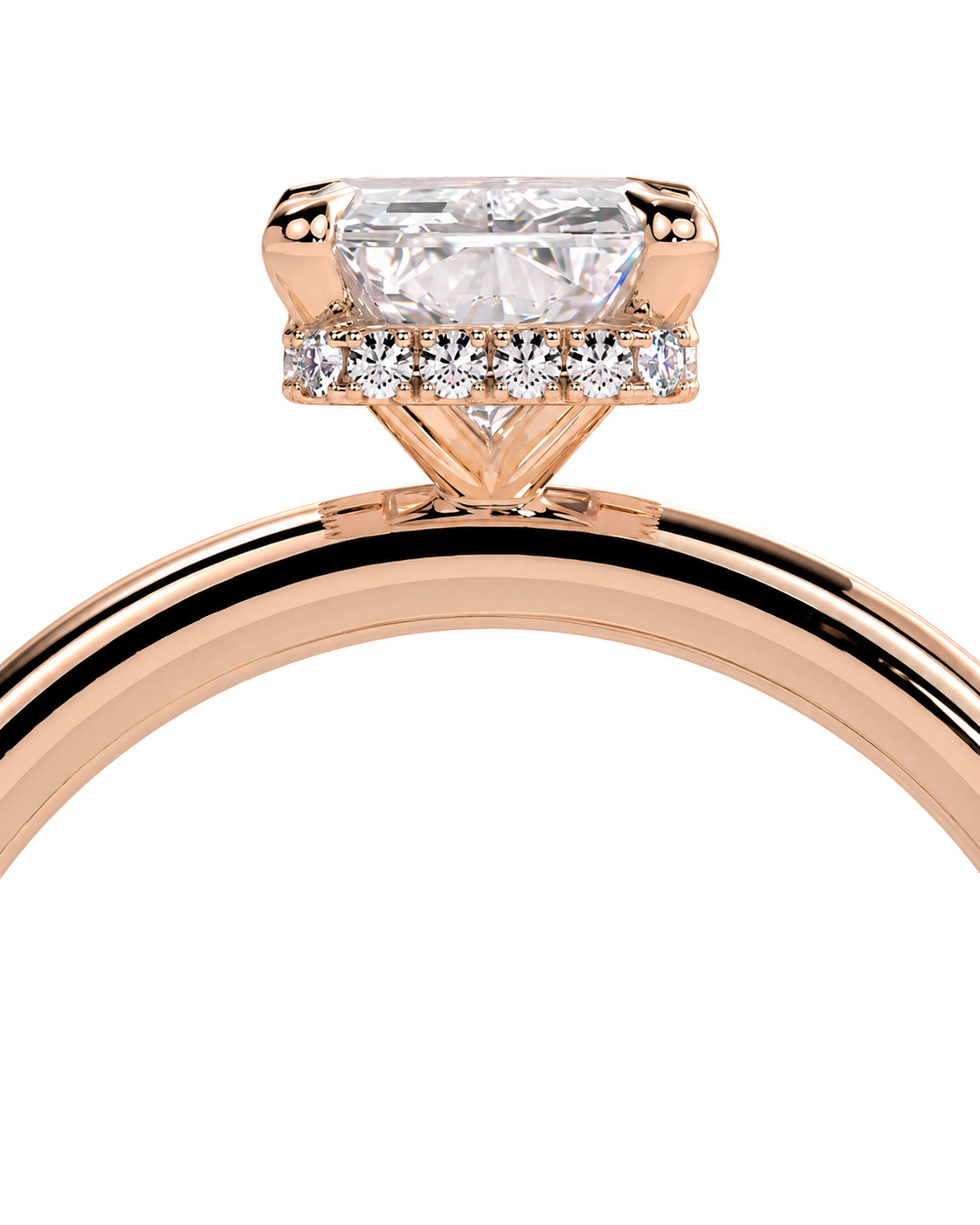 color_10K_RG, color_14K_RG &&Rose gold ring with a large rectangular clear center stone and smaller side stones, shown in a close-up studio shot on a white background.