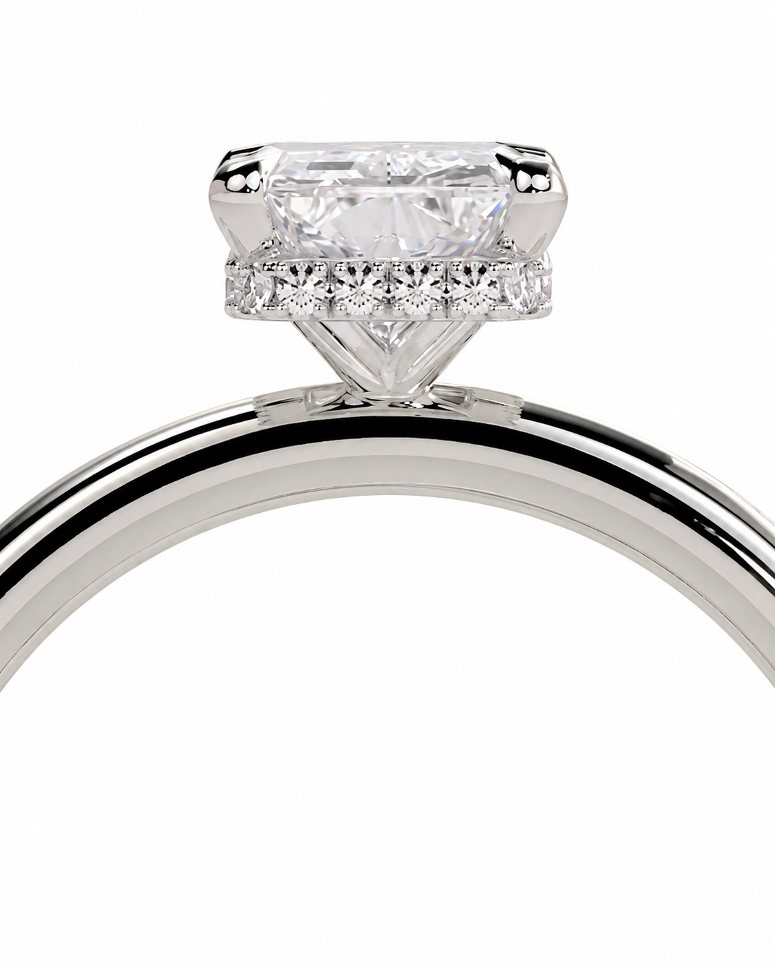 color_925_SIL,color_935_ARG,color_10K_WG, color_14K_WG &&A close-up studio shot of a silver-toned diamond ring featuring a large rectangular center stone and a halo of smaller diamonds, set against a plain white background.