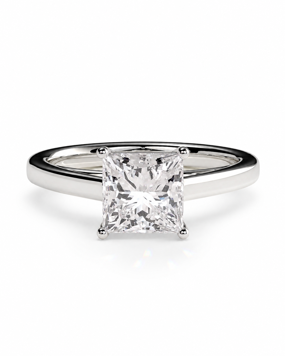 color_925_SIL,color_935_ARG,color_10K_WG, color_14K_WG &&A classic princess-cut diamond solitaire engagement ring in a polished silver-colored metal band, set against a clean white background.