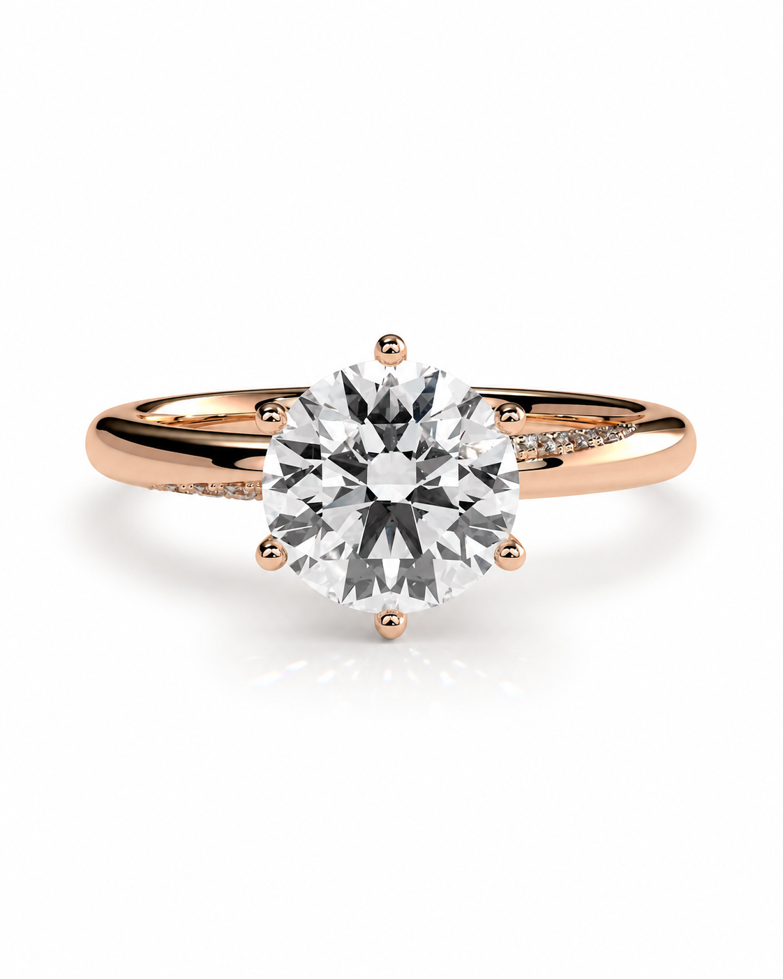 color_10K_RG, color_14K_RG &&A rose gold solitaire engagement ring with a large round brilliant-cut diamond center stone and small pavé diamonds on the shank, shown on a clean white background.
