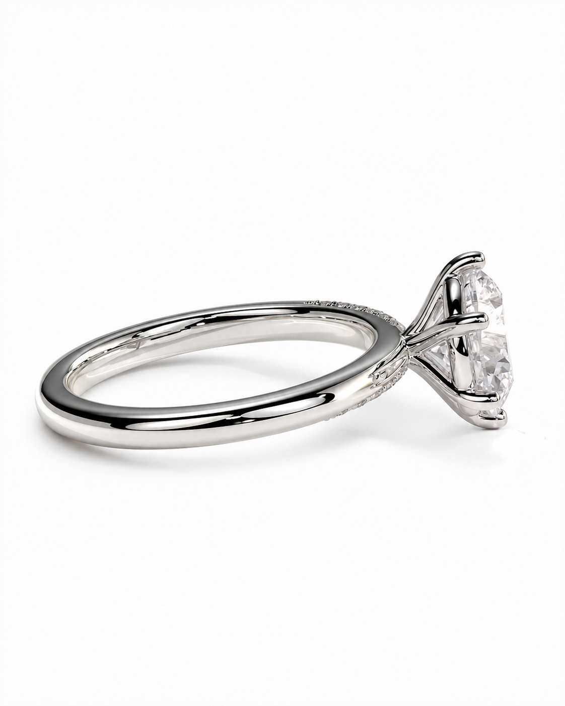 color_925_SIL,color_935_ARG,color_10K_WG, color_14K_WG &&A silver-toned solitaire engagement ring with a round brilliant-cut diamond, shown in a side profile view against a clean white background.