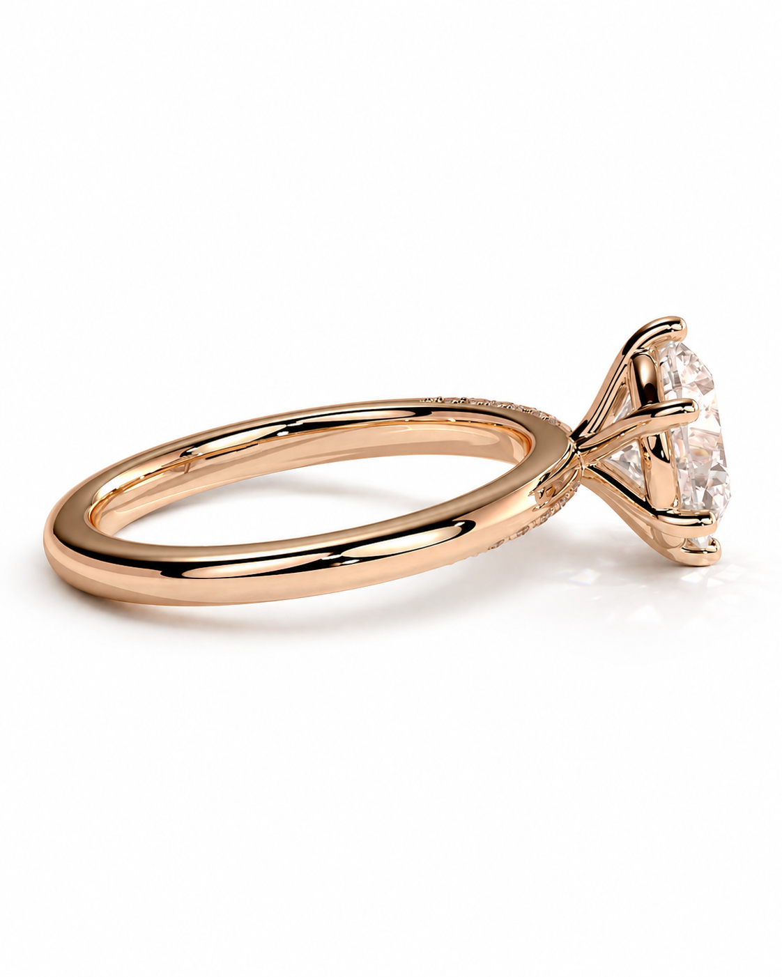 color_10K_RG, color_14K_RG &&A rose gold engagement ring with a triangular prong setting holding a clear round-cut gemstone, shown on a clean white background.