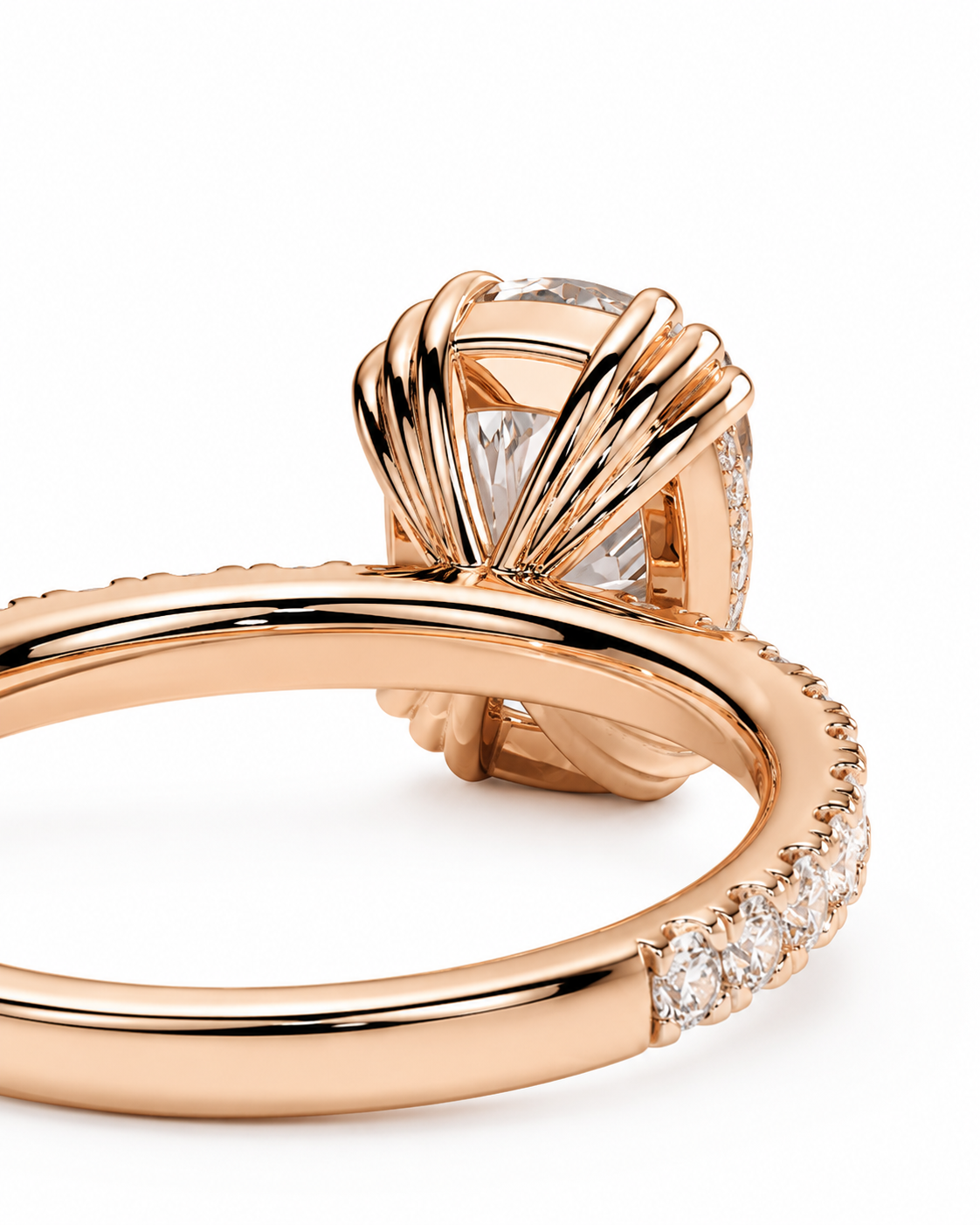 color_10K_RG, color_14K_RG &&Rose gold ring with a twisted fan-like halo setting and a clear center stone, shown on a clean white background.