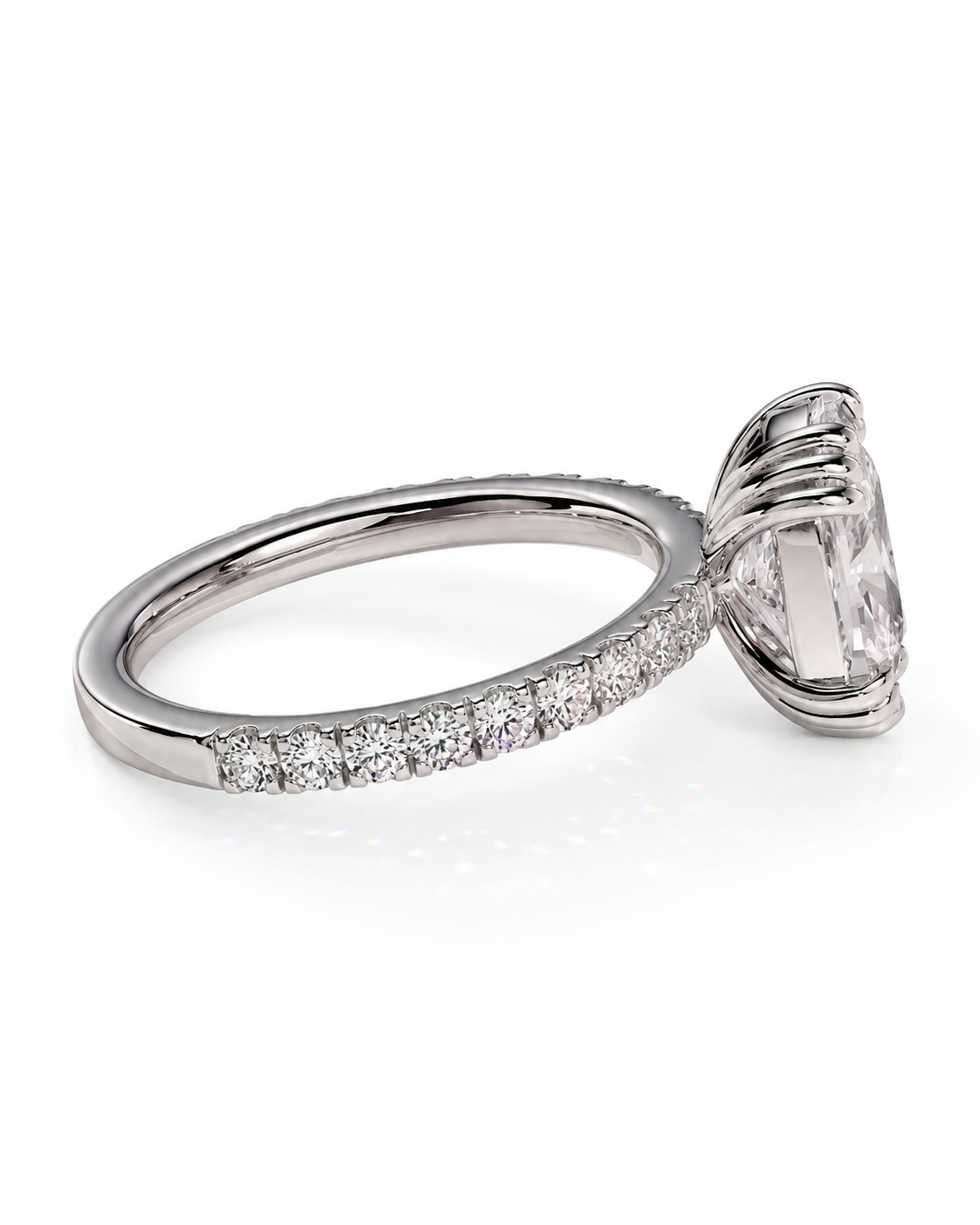 color_925_SIL,color_935_ARG,color_10K_WG, color_14K_WG &&A silver-toned diamond ring featuring a large oval-cut center stone in a prong setting, with a pavé band of smaller round diamonds, shown on a clean white background.