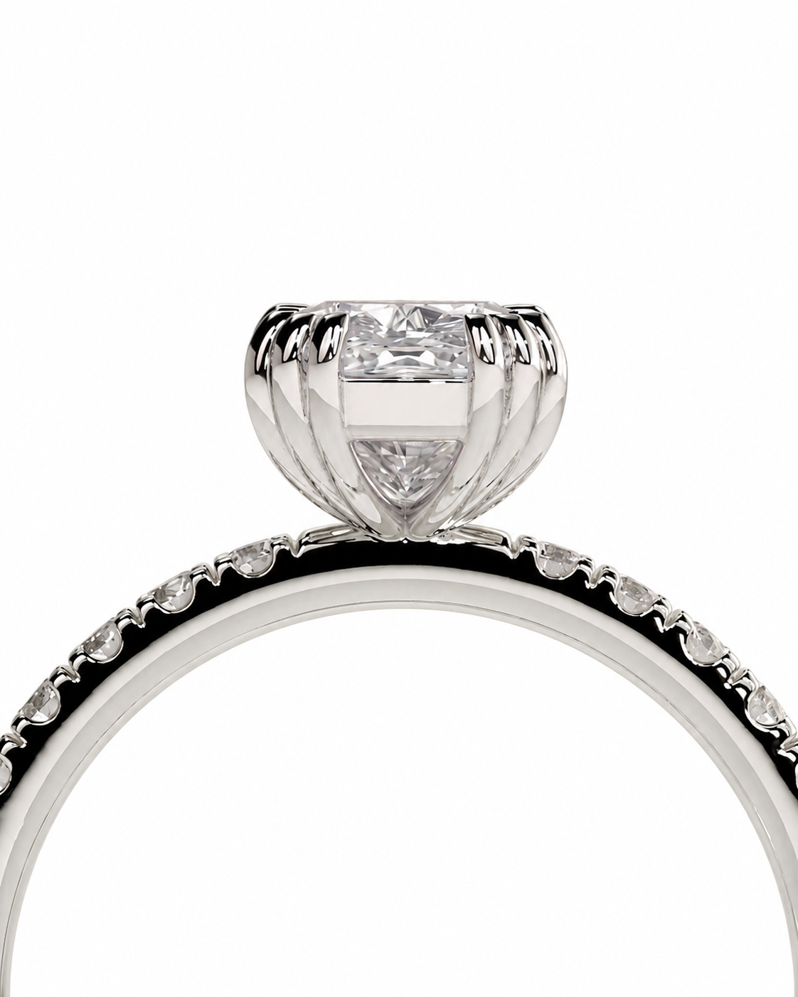 color_925_SIL,color_935_ARG,color_10K_WG, color_14K_WG &&A close-up studio shot of a silver-toned diamond ring featuring a large central round-cut diamond in a prong setting, with a band accented by small diamonds along the inner edge, set against a plain white background.