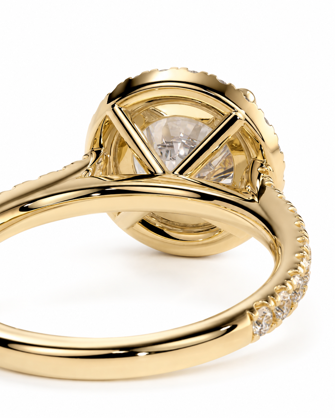 color_10K_YG, color_14K_YG &&Close-up of a yellow gold ring with a round clear gemstone in a geometric setting, showing the polished band and small side stones on a white background.