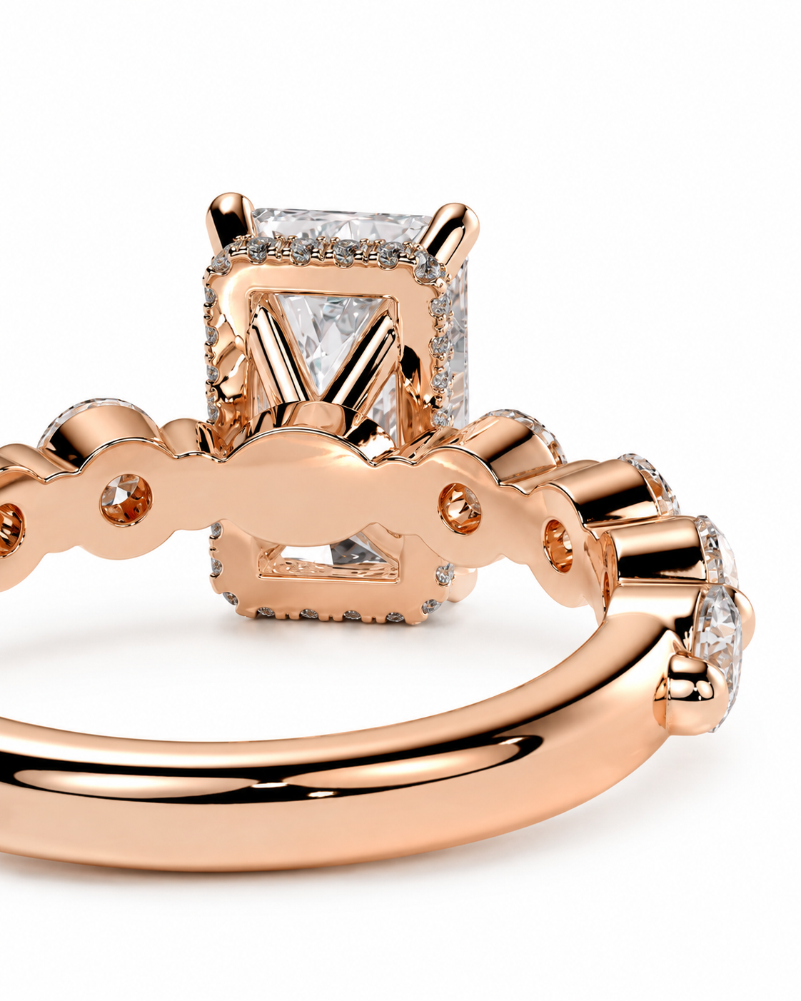 color_10K_RG, color_14K_RG &&Close-up of a rose gold ring with a rectangular halo and clear gemstones on a white background.