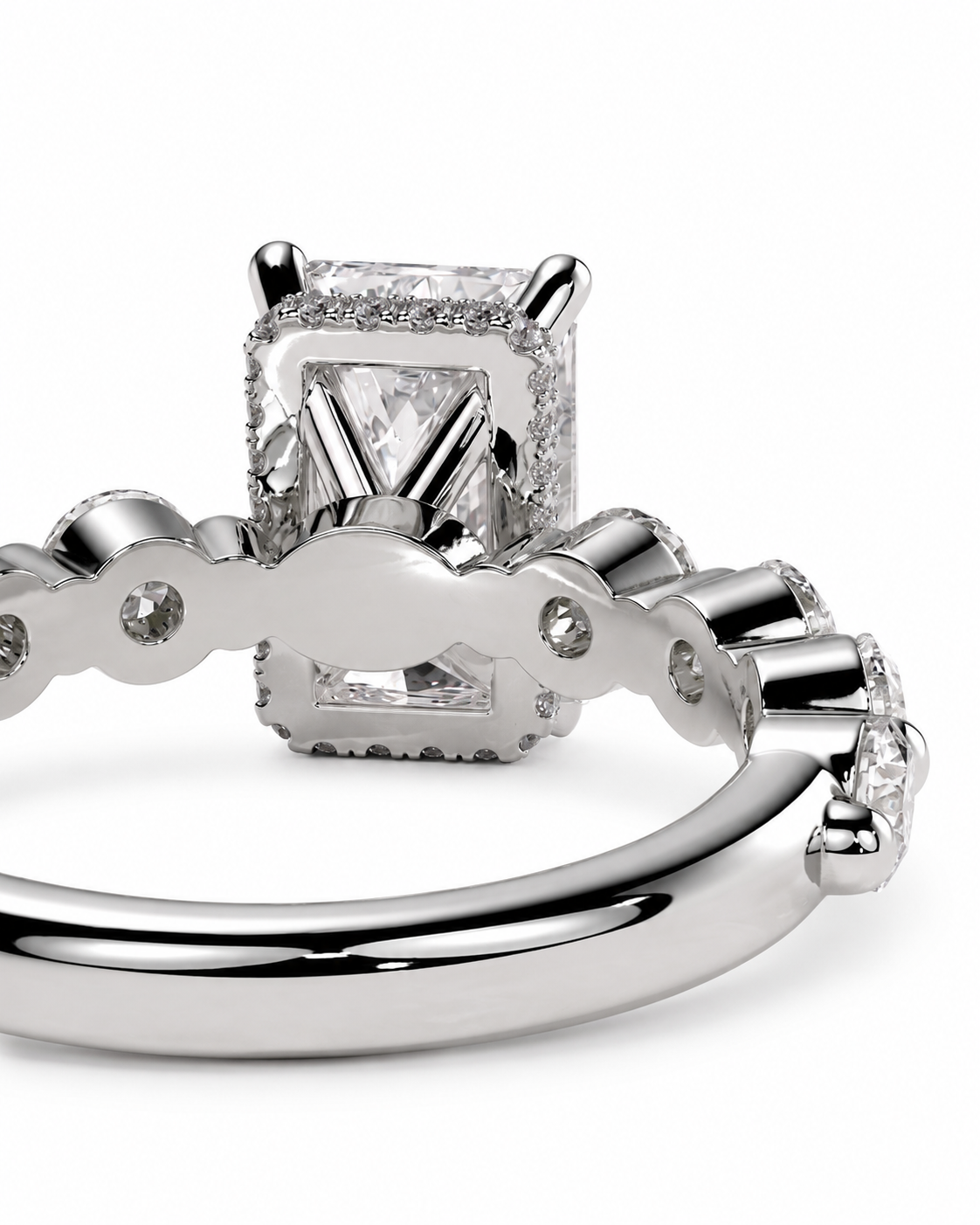 color_925_SIL,color_935_ARG,color_10K_WG, color_14K_WG &&A close-up studio shot of a silver-toned diamond ring showing the back of the setting with a square-cut center stone and small accent diamonds along the band, on a white background.