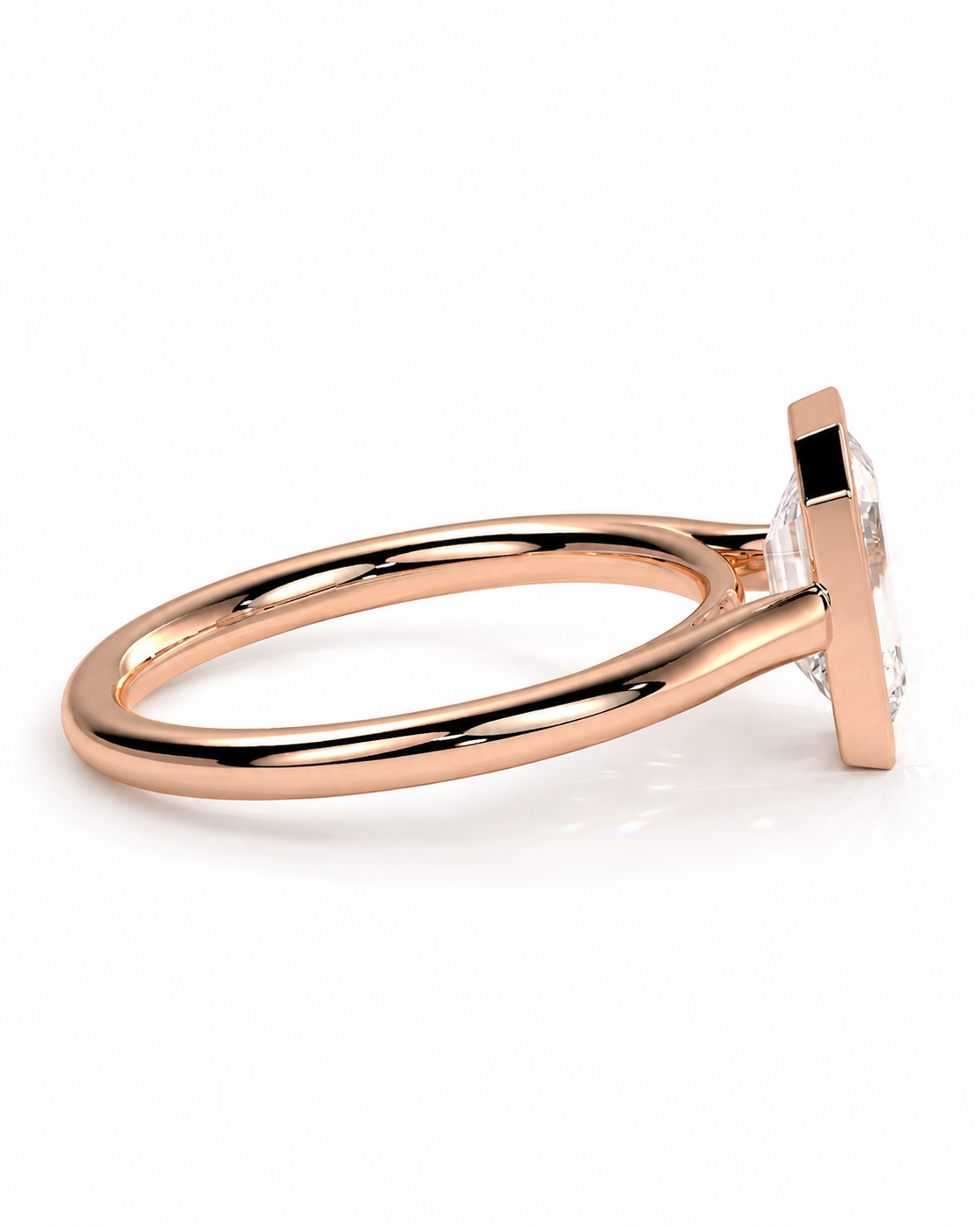 color_10K_RG, color_14K_RG &&A rose gold ring with a square bezel setting and a clear rectangular gemstone, shown in a side profile view on a white background.