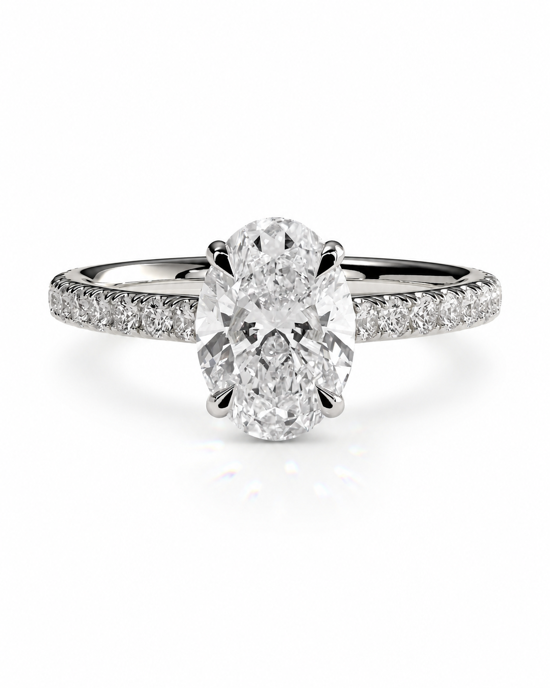 color_925_SIL,color_935_ARG,color_10K_WG, color_14K_WG &&An oval-cut diamond engagement ring with a brilliant solitaire center stone and a pavé-set diamond band in a silver-colored metal, shown on a clean white background.