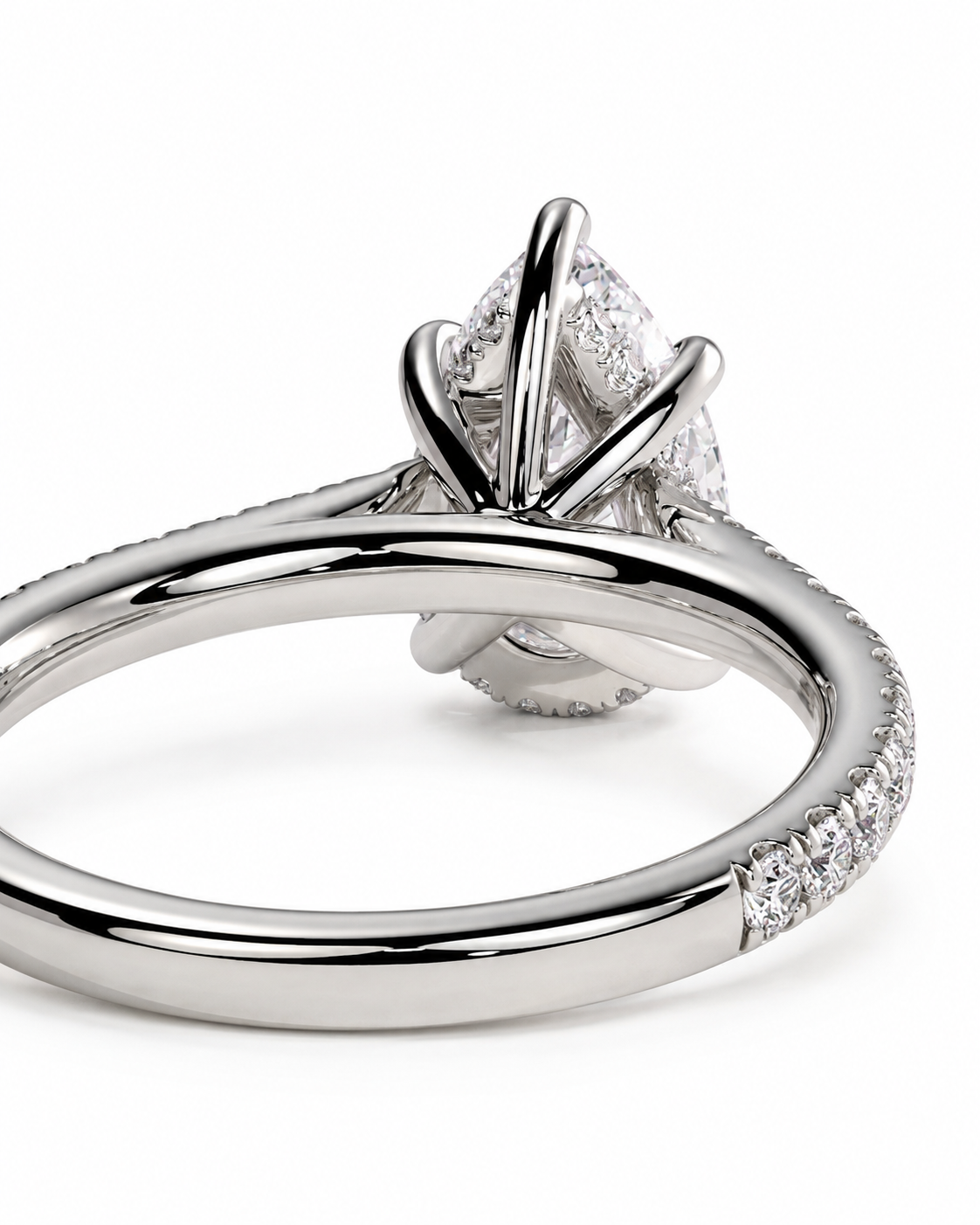color_925_SIL,color_935_ARG,color_10K_WG, color_14K_WG &&A close-up studio shot of a silver-toned engagement ring featuring a marquise-cut center stone in a four-prong setting, with a pavé band on a white background.