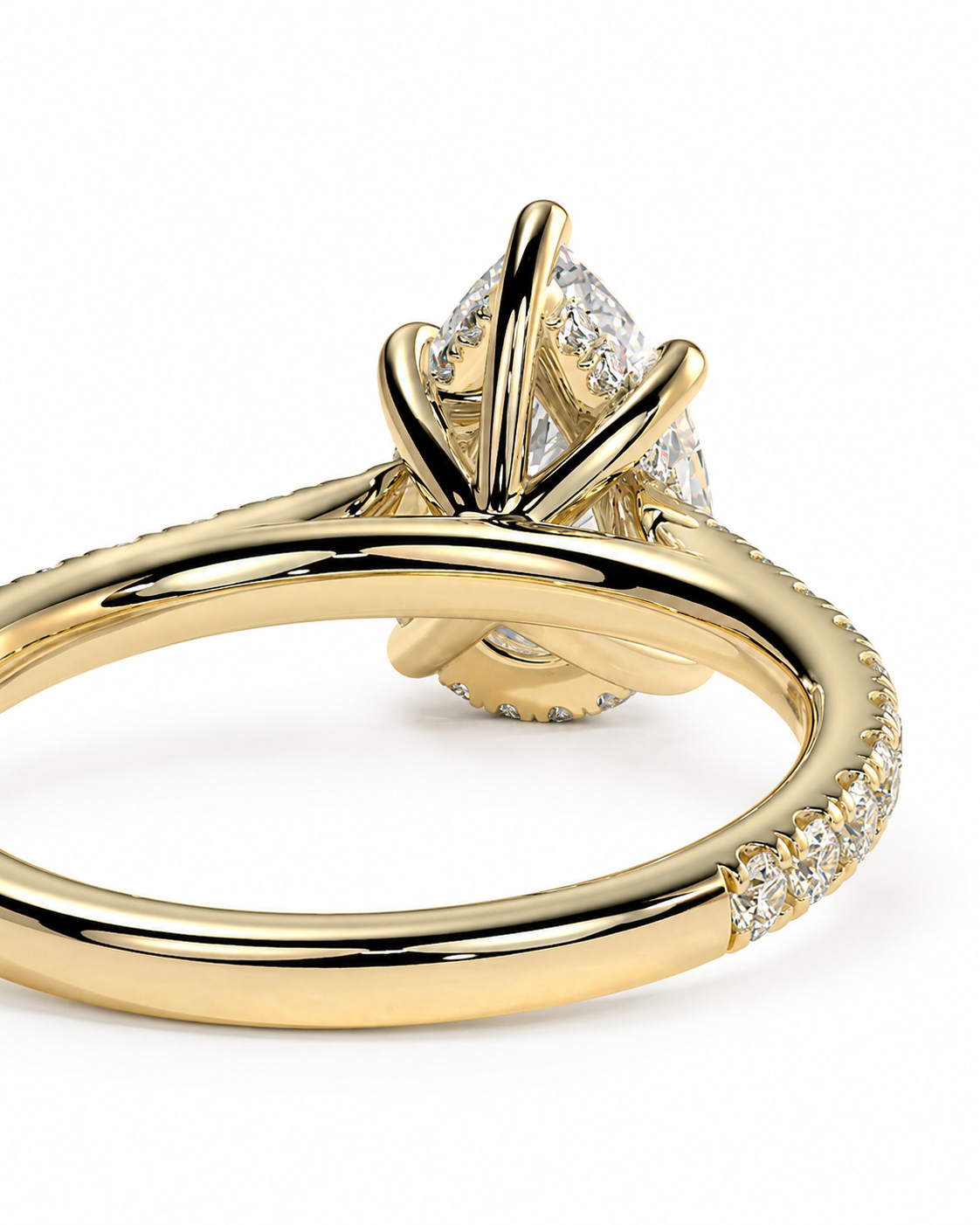 color_10K_YG, color_14K_YG &&A close-up shot of a yellow gold ring with a pear-cut diamond center stone and pavé-set diamonds along the band, set against a plain white background.