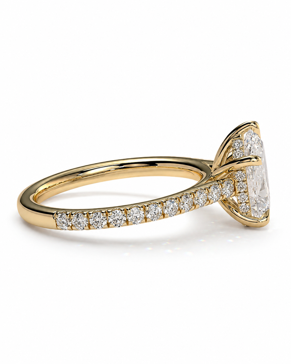 color_10K_YG, color_14K_YG &&A yellow gold ring featuring a large cushion-cut diamond center stone and a pavé band set with small round diamonds, shown on a clean white background.