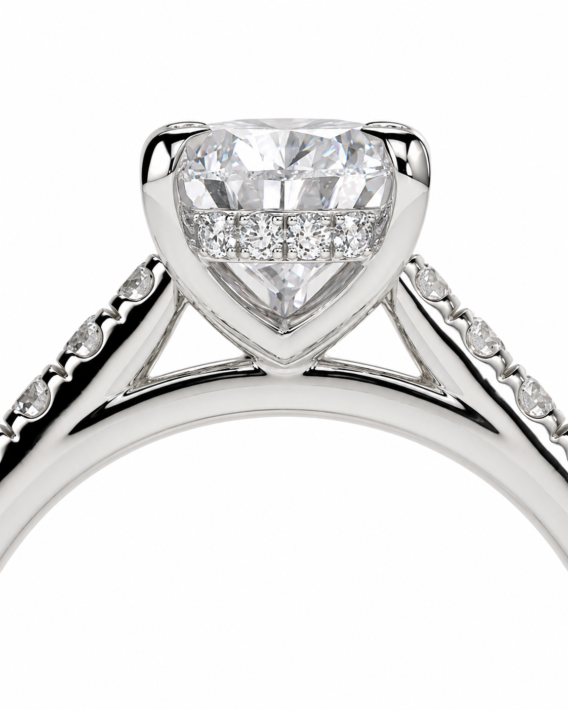 color_925_SIL,color_935_ARG,color_10K_WG, color_14K_WG &&A close-up studio shot of a silver-toned diamond ring featuring a large heart-shaped center stone with a halo of smaller diamonds and pavé-set side stones on a white background.