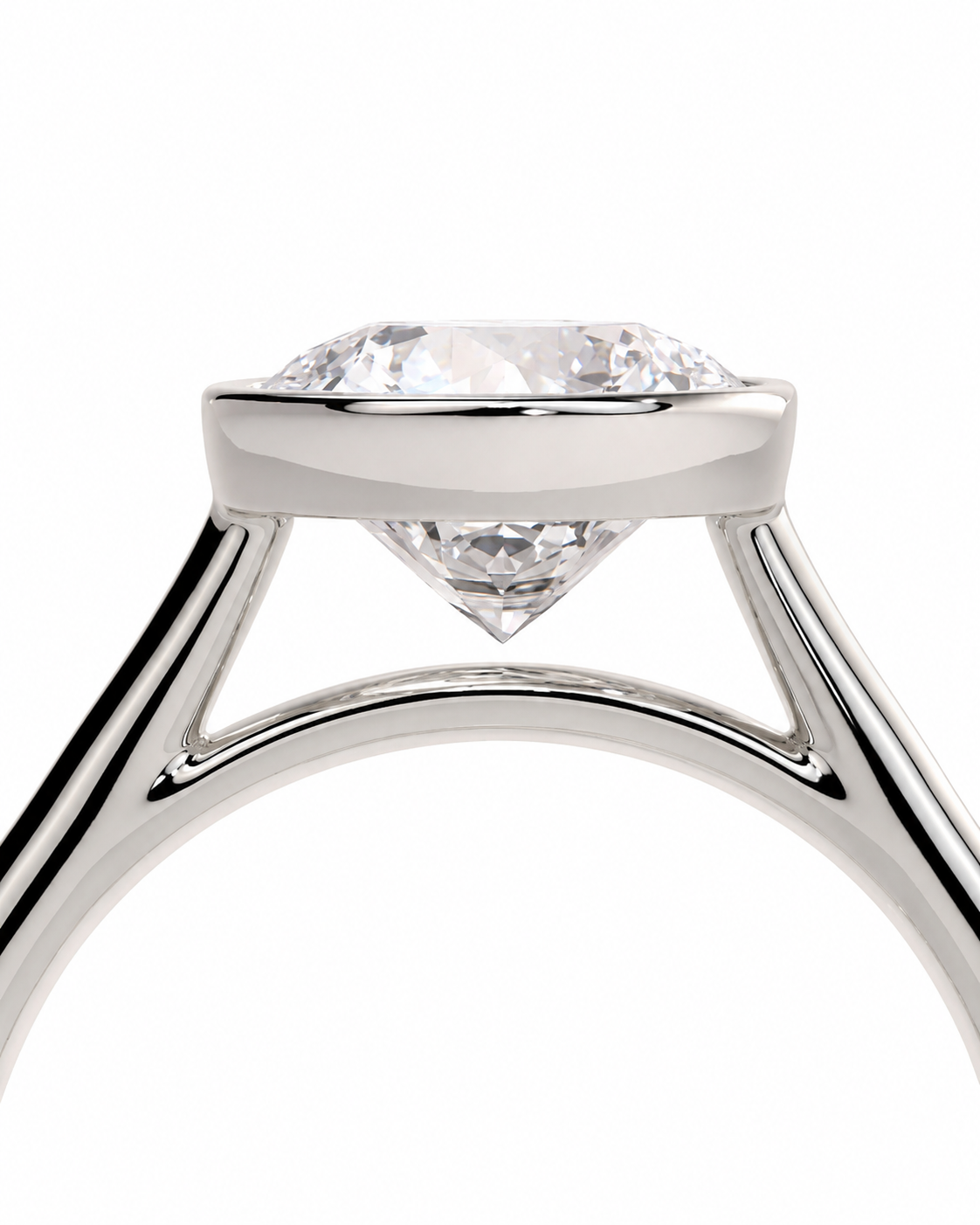 color_925_SIL,color_935_ARG,color_10K_WG, color_14K_WG &&Close-up of a diamond ring with a brilliant round-cut center stone in a polished silver-colored setting, shown against a plain white background.
