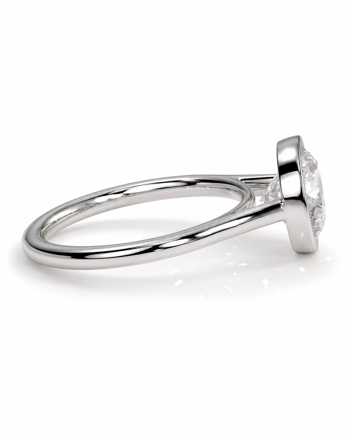 color_925_SIL,color_935_ARG,color_10K_WG, color_14K_WG &&A silver-toned diamond ring with a round brilliant-cut center stone in a prong setting, shown from a side profile view on a clean white background.