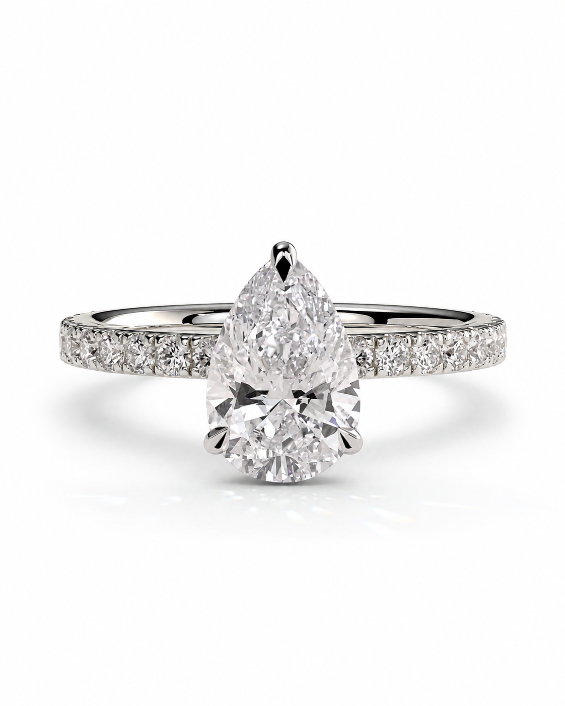 color_925_SIL,color_935_ARG,color_10K_WG, color_14K_WG &&A pear-cut diamond engagement ring with a pavé band, shown on a clean white background.