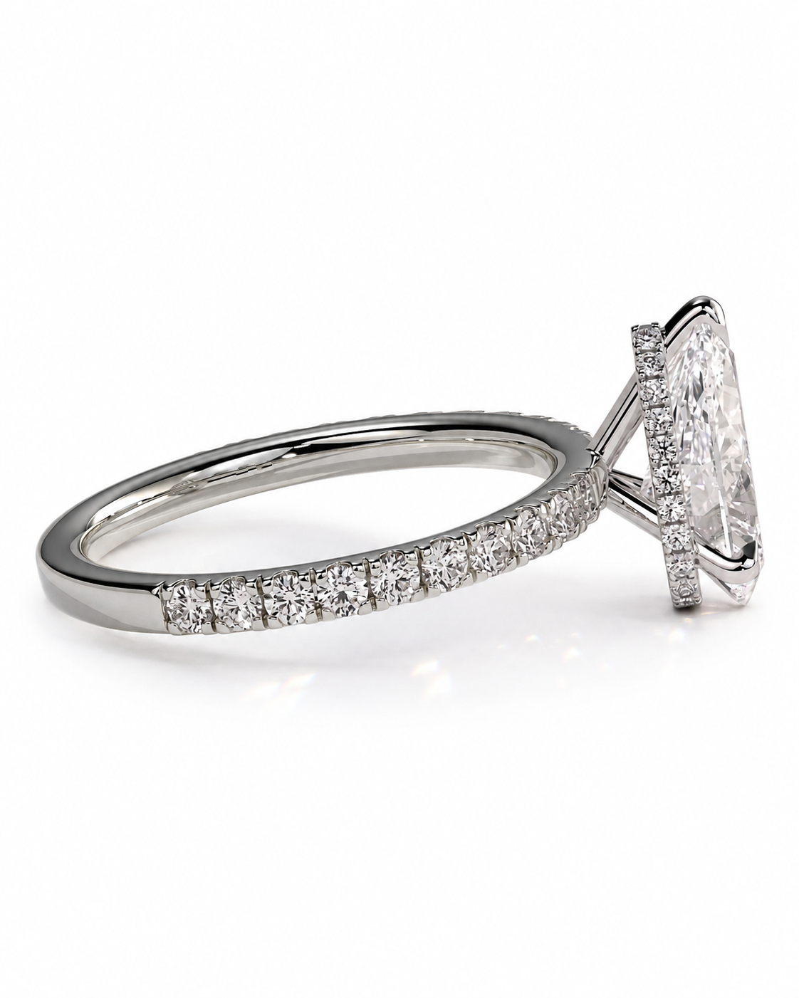 color_925_SIL,color_935_ARG,color_10K_WG, color_14K_WG &&A diamond engagement ring featuring a marquise-cut center stone in a prong setting with a pavé band, shown on a clean white background.
