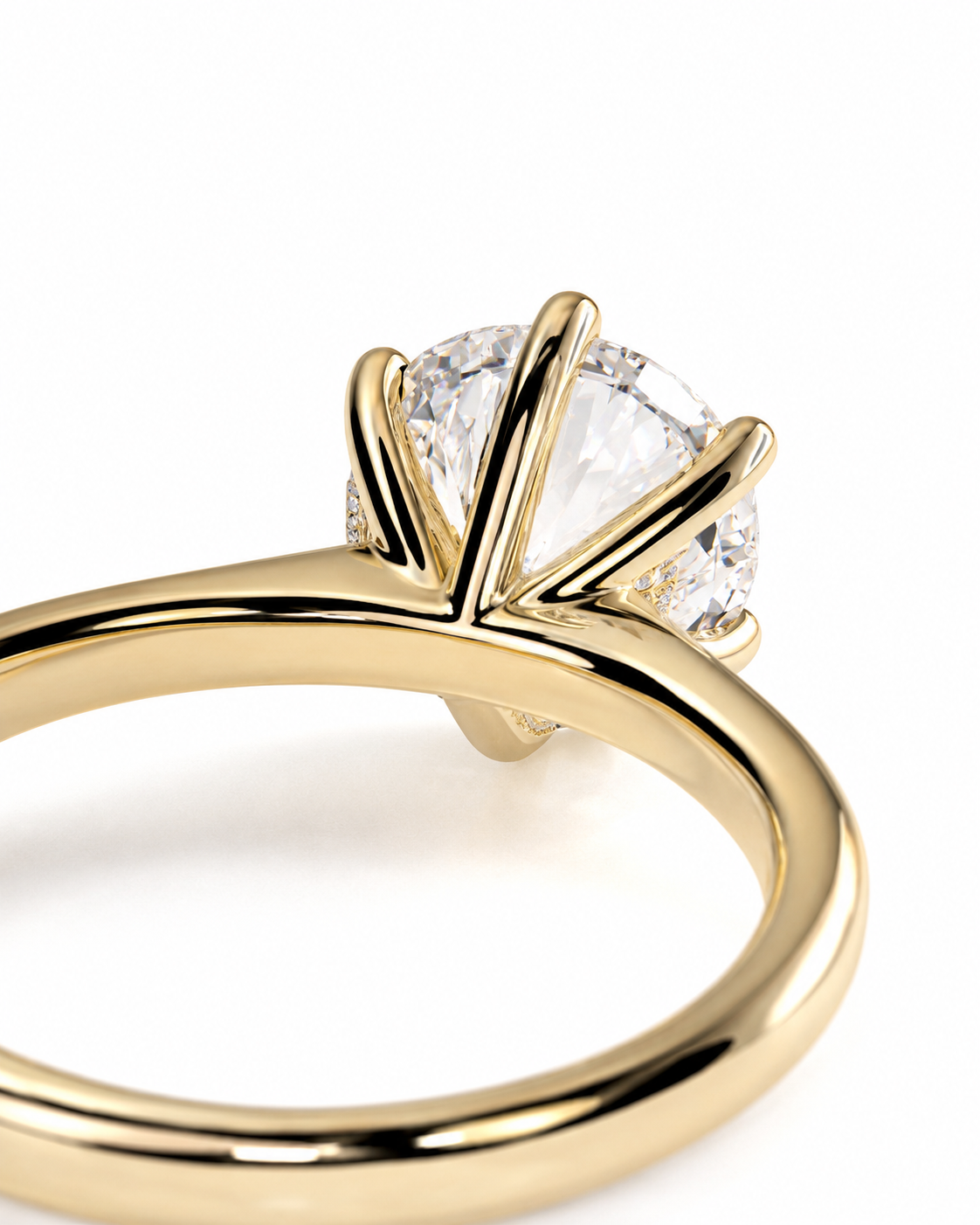 color_10K_YG, color_14K_YG &&A close-up shot of a yellow gold ring with a brilliant round-cut clear gemstone in a prong setting, shown against a clean white background.