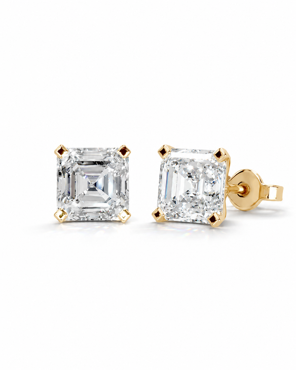 color_10K_YG, color_14K_YG &&A pair of diamond stud earrings with emerald-cut diamonds in yellow gold settings, shown on a clean white background.