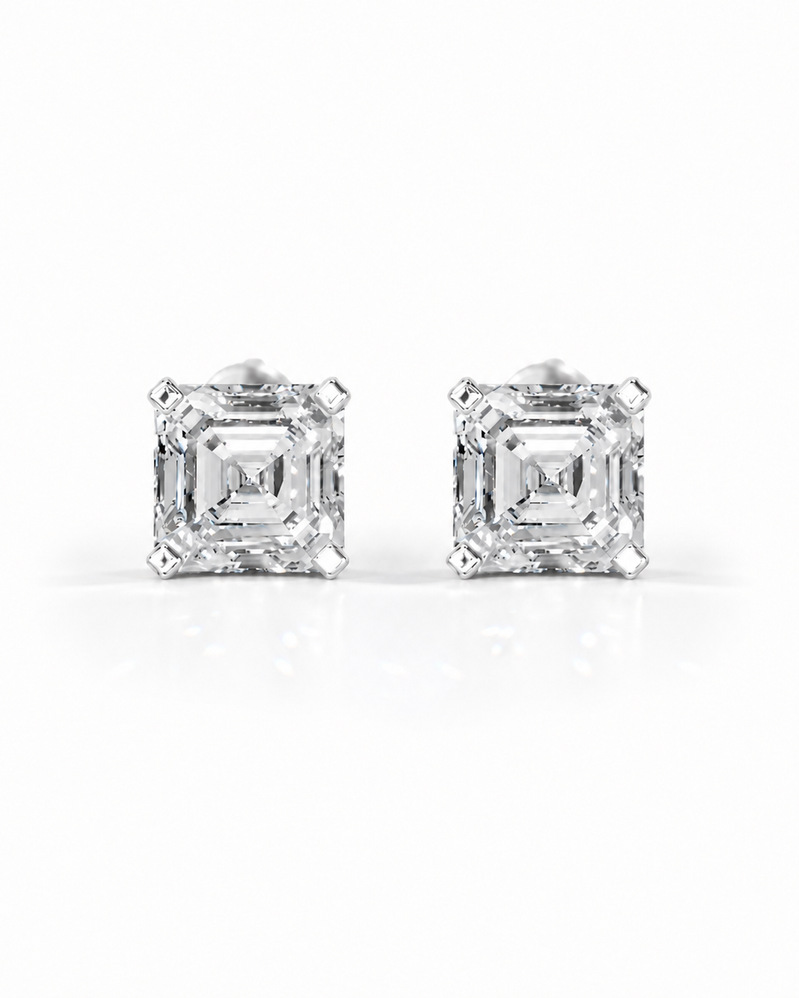 color_925_SIL,color_935_ARG,color_10K_WG, color_14K_WG &&Pair of blue gemstone stud earrings on a white background