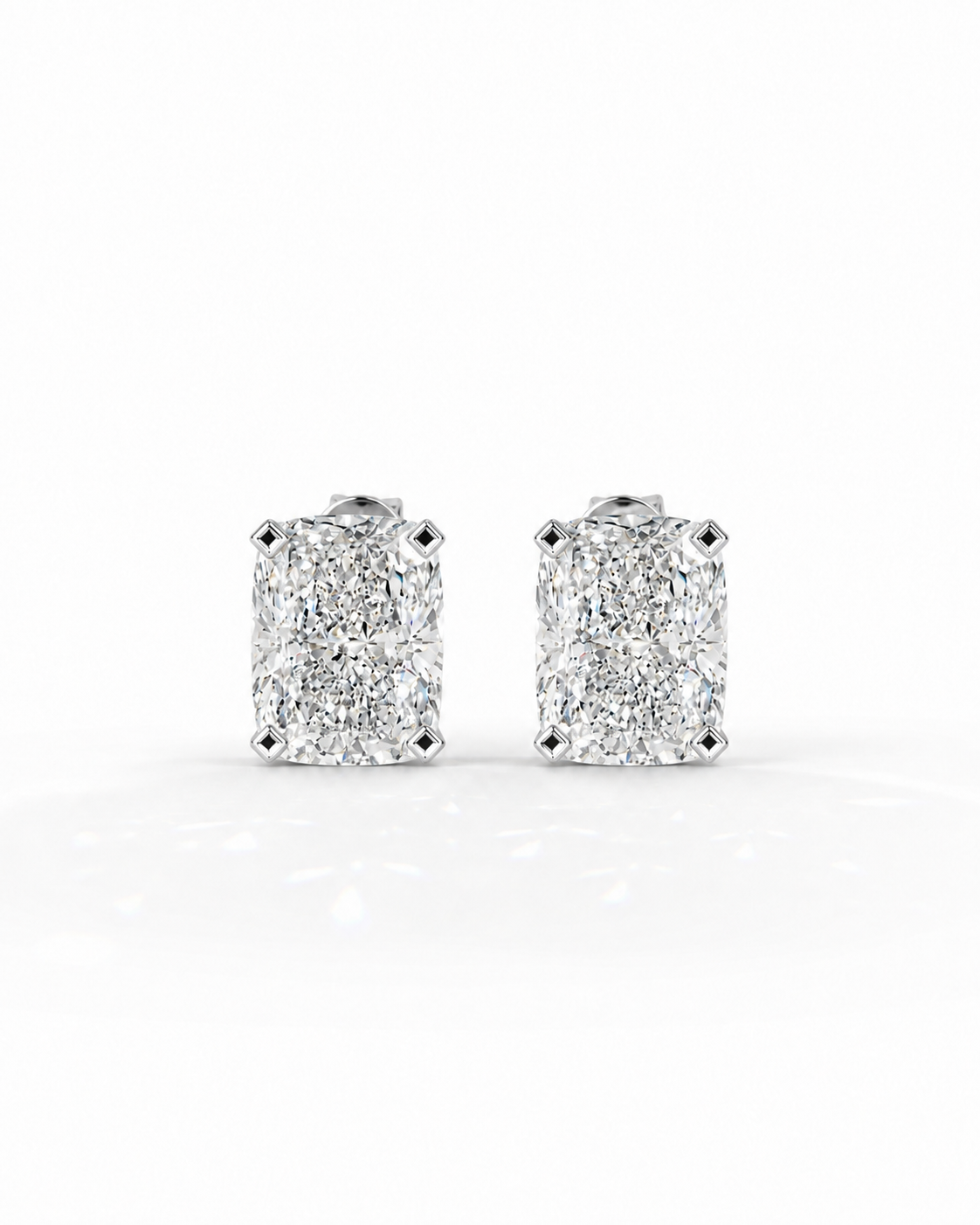 color_925_SIL,color_935_ARG,color_10K_WG, color_14K_WG &&A pair of rectangular cushion-cut diamond stud earrings in a four-prong setting, shown on a clean white background.
